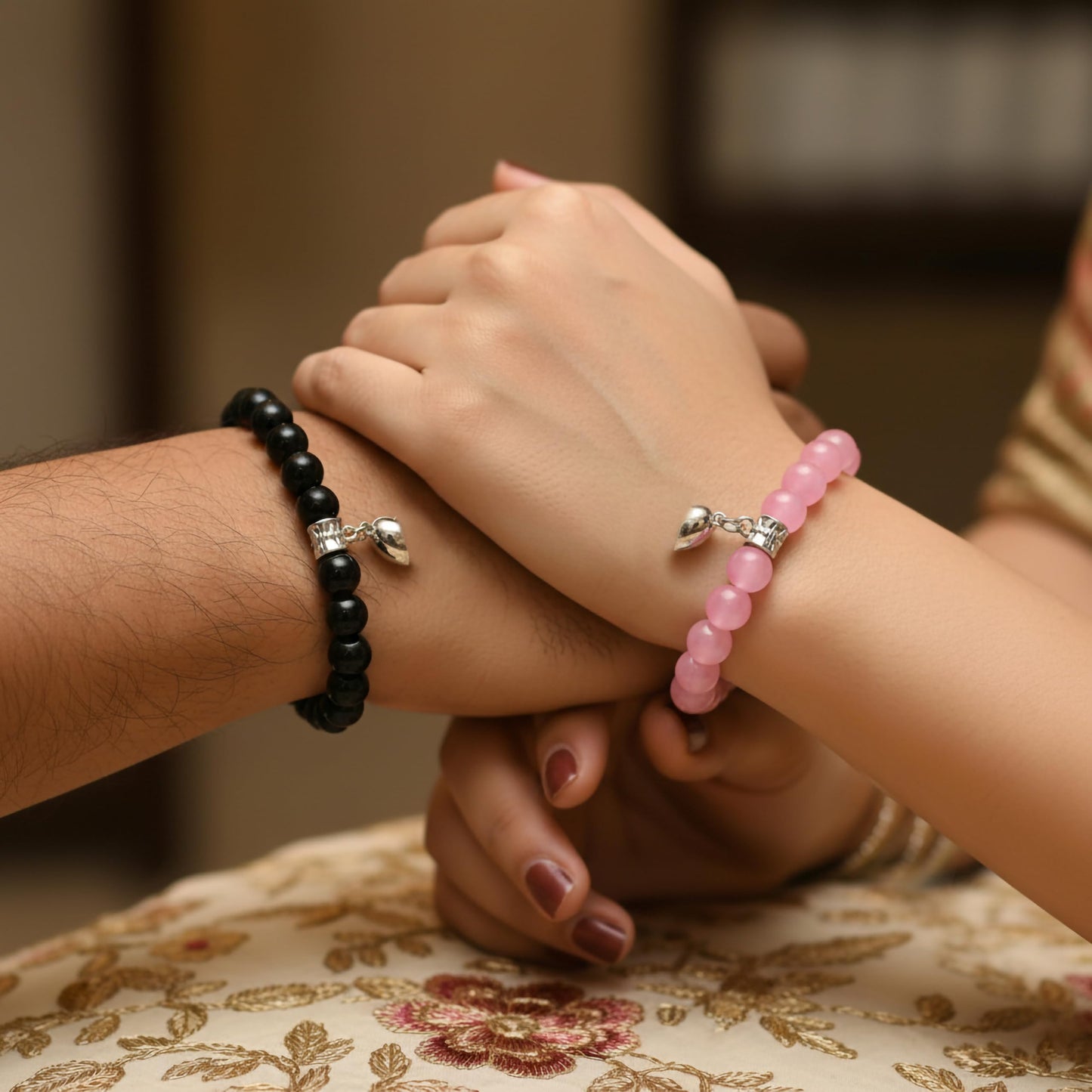 Create a sweet best-friend wrist look using 3-pair cord bracelets with heart charms.