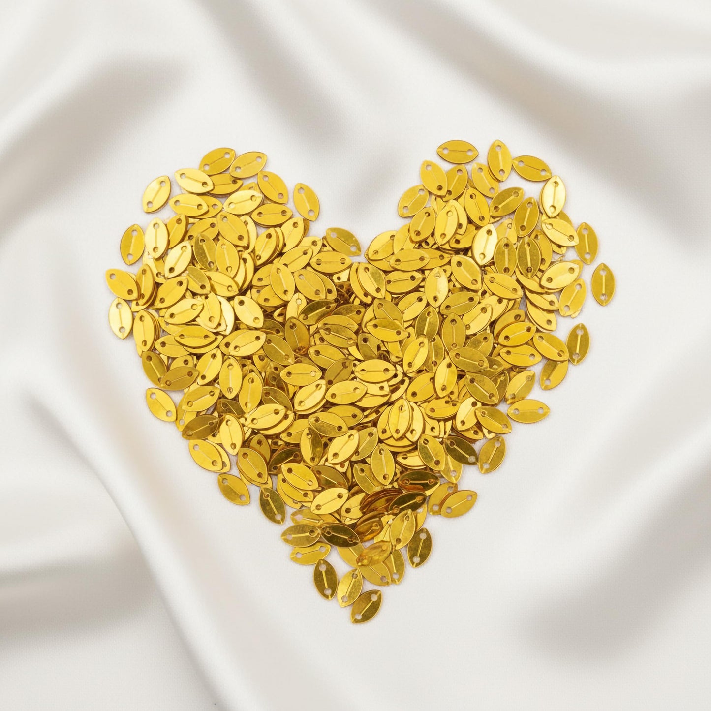 Bring festive shine into dress decoration with metallic gold metallic sequin embellishments for boutique craft projects.