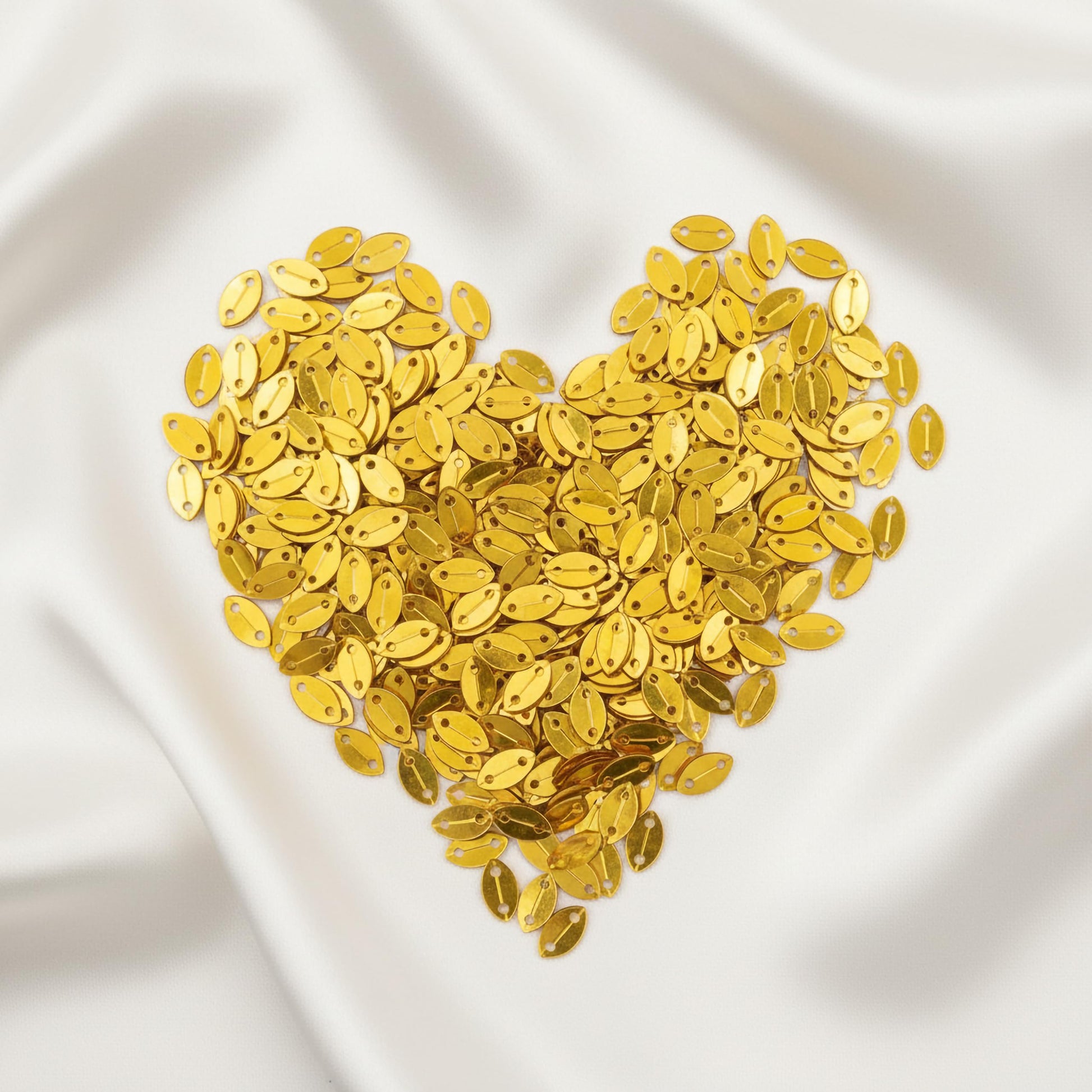 Bring festive shine into dress decoration with metallic gold metallic sequin embellishments for boutique craft projects.