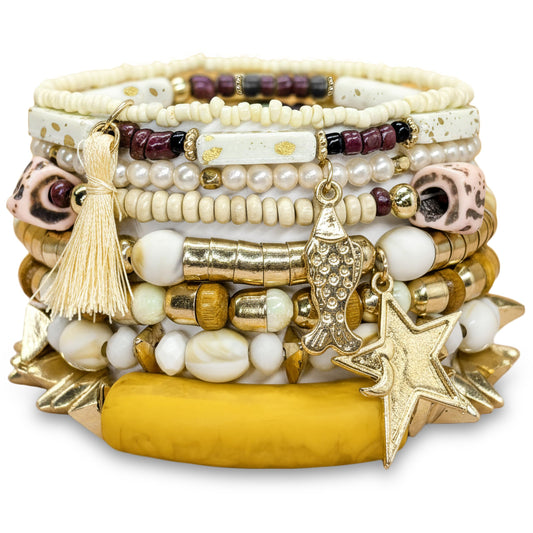 Bring beachy boho charm to wrist stacks with a white beaded bracelet set and shell accents.