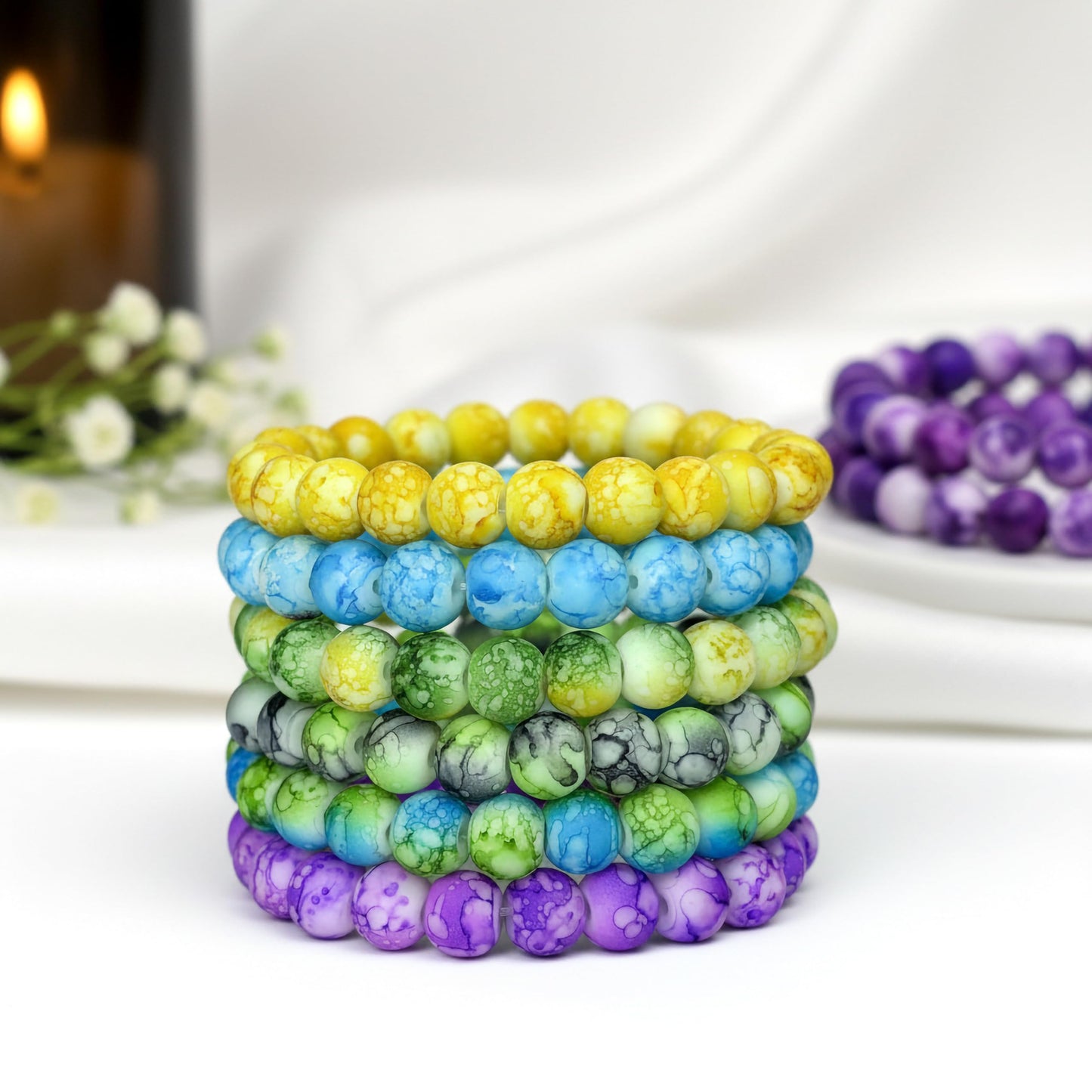 Make matching hand bands feel stylish with multicolor matte marble beads and simple stretch wear.