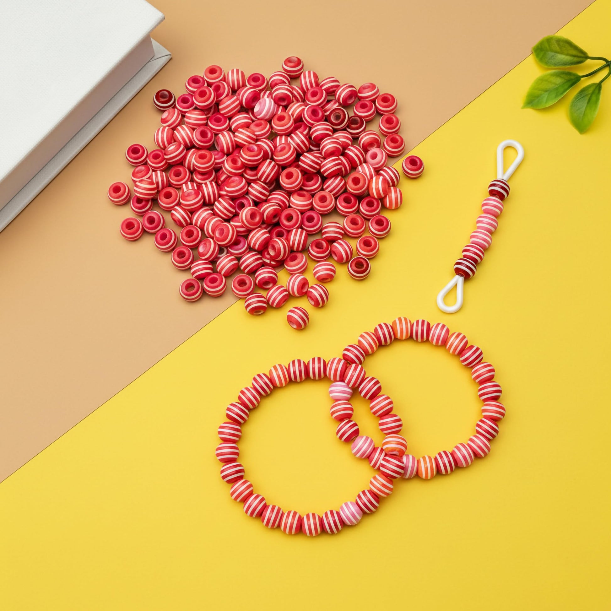 Bulk red beads with white lines for craft projects