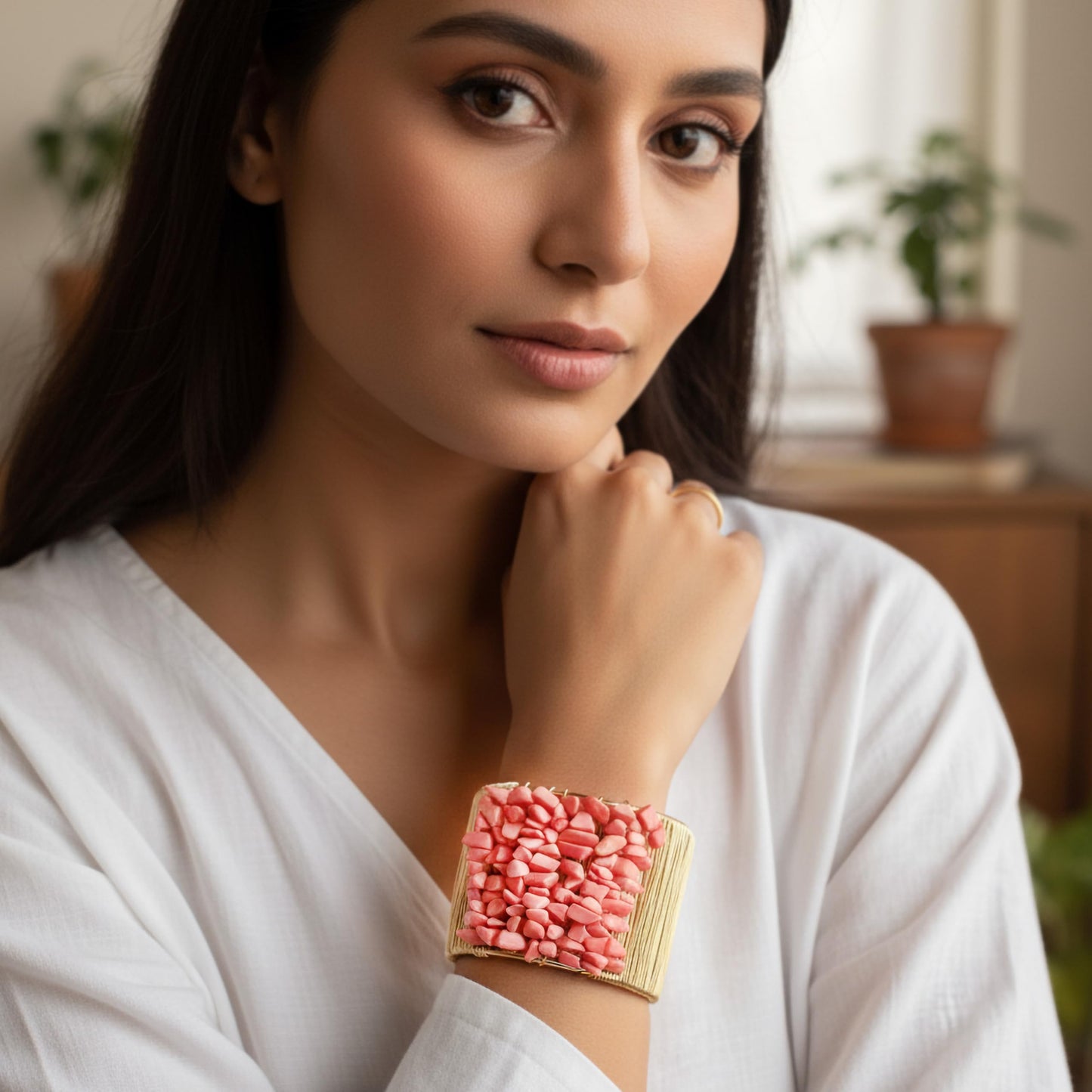 Add a bold handmade accent to outfits using a pink chunky stone cuff bracelet.