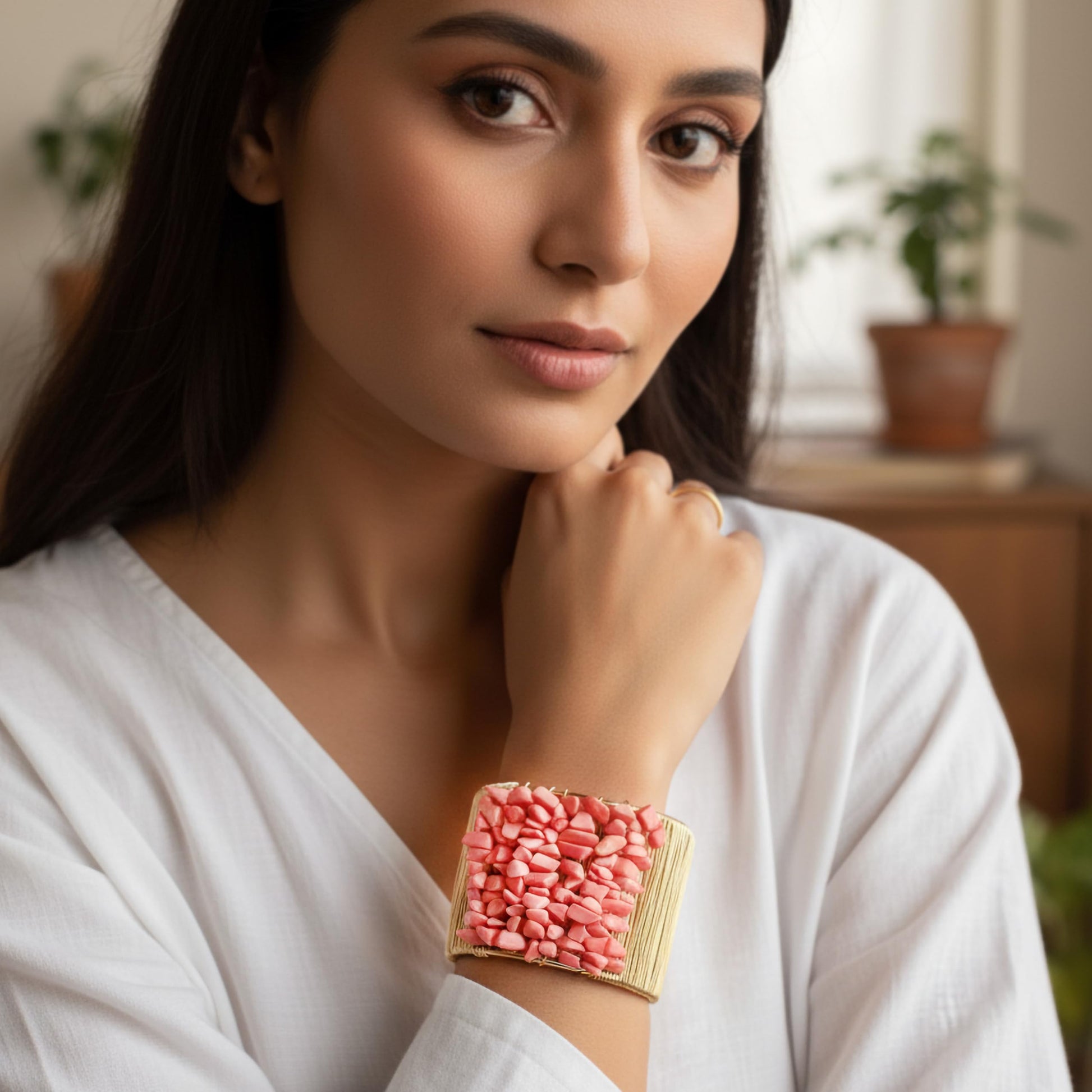 Add a bold handmade accent to outfits using a pink chunky stone cuff bracelet.