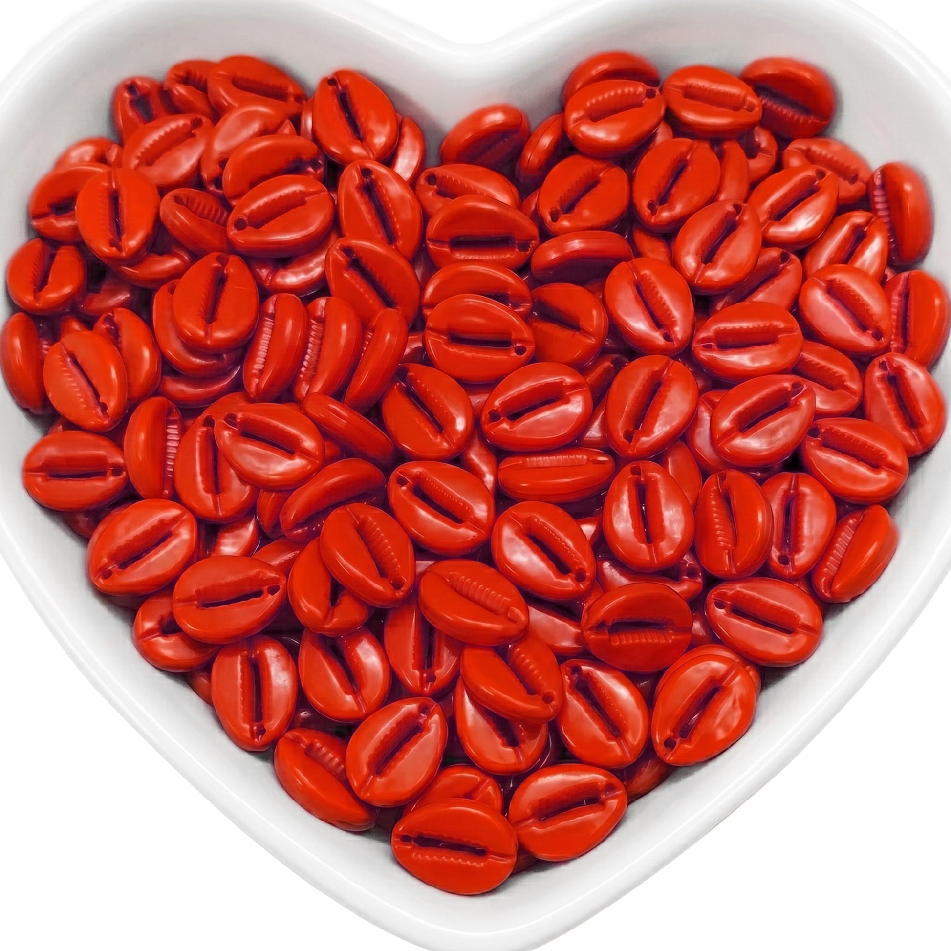 Create beach-inspired jewelry with red cowrie-style beads for charms, necklaces and crafts.