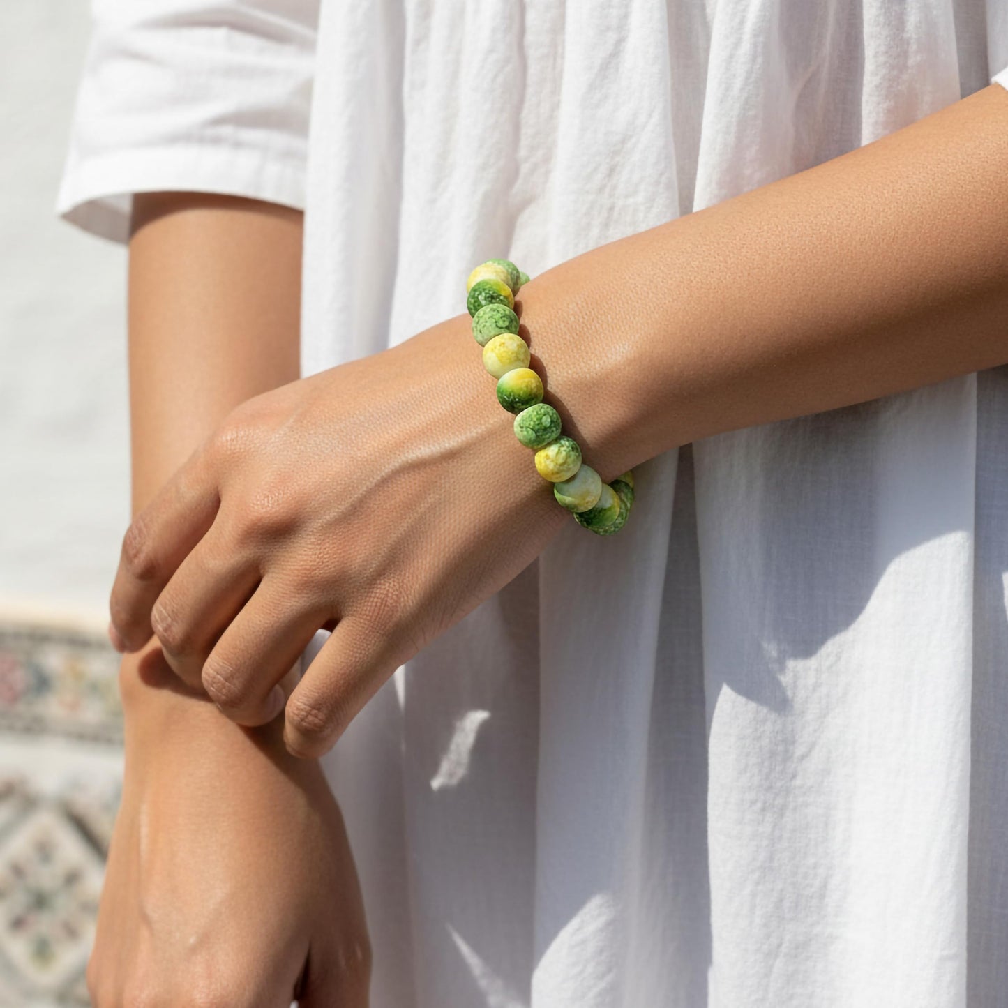 Style everyday outfits with a yellow and green bead bracelet that feels cute, light and easy to layer.