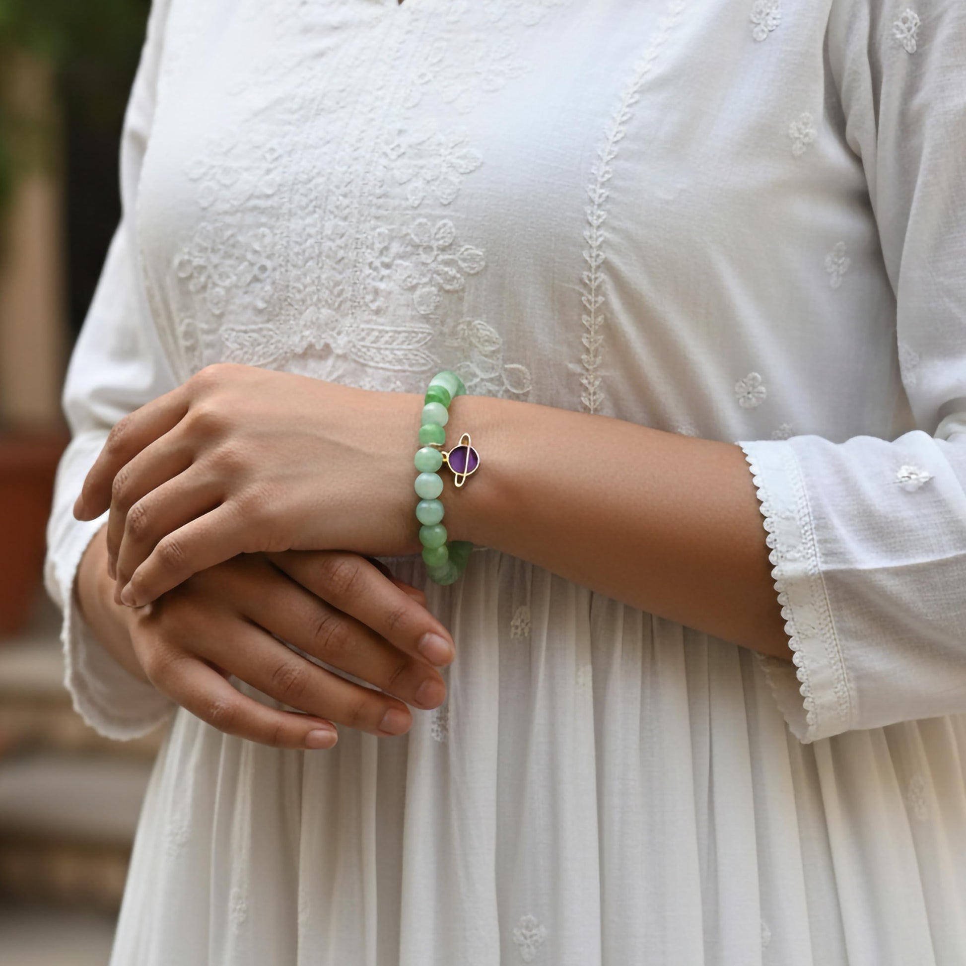Create a playful accessory look using green dualtone beads and cute bracelet charms.