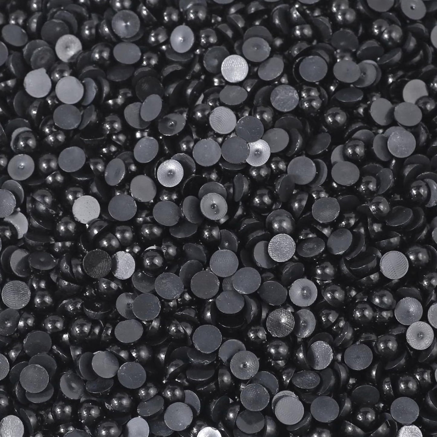 Smooth black flatback pearls turn phone case art into more expressive craft work.
