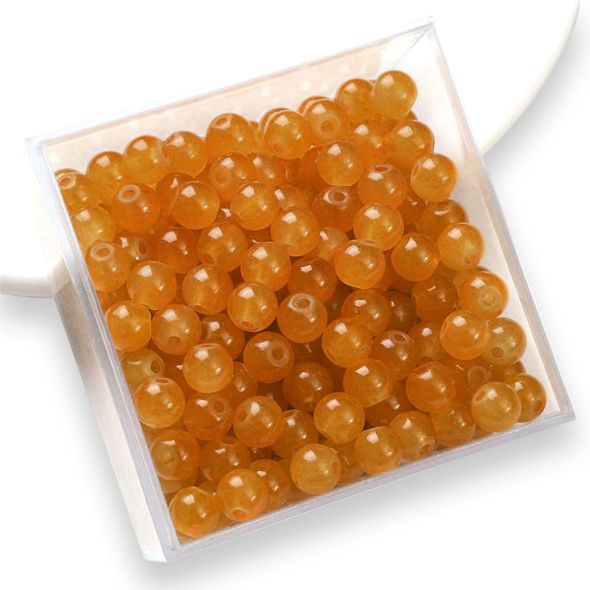 The clean decorative look finish of orange and pearl 6 mm and 6mm beads works nicely in bracelet making, necklace making and DIY jewellery projects.
