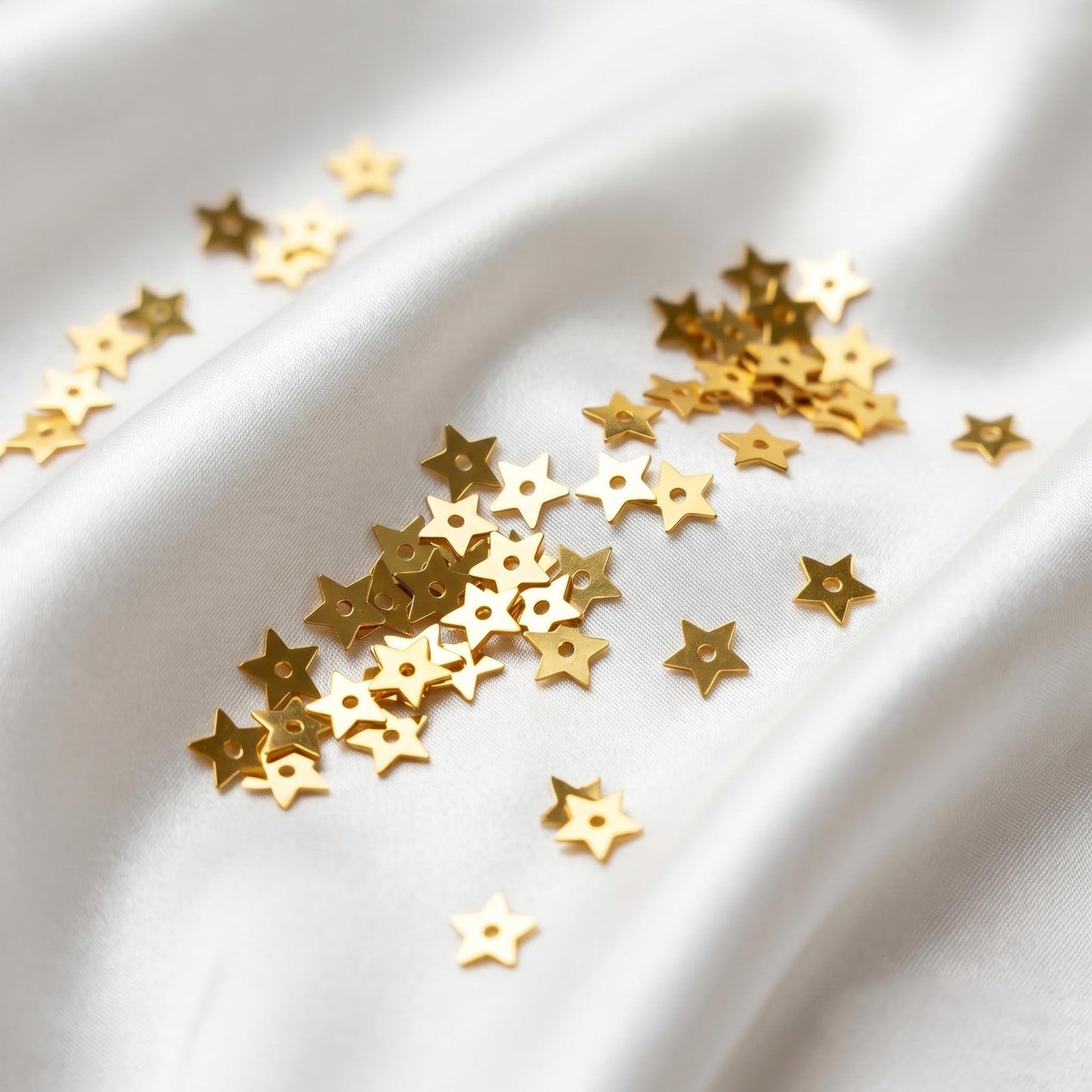 Give handmade dress decoration a fresh accent through shiny gold star chamki pieces.