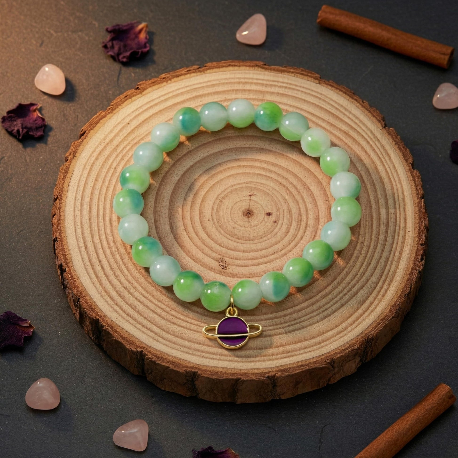 Layer cute wrist stacks with green dualtone bead details and charm accents.