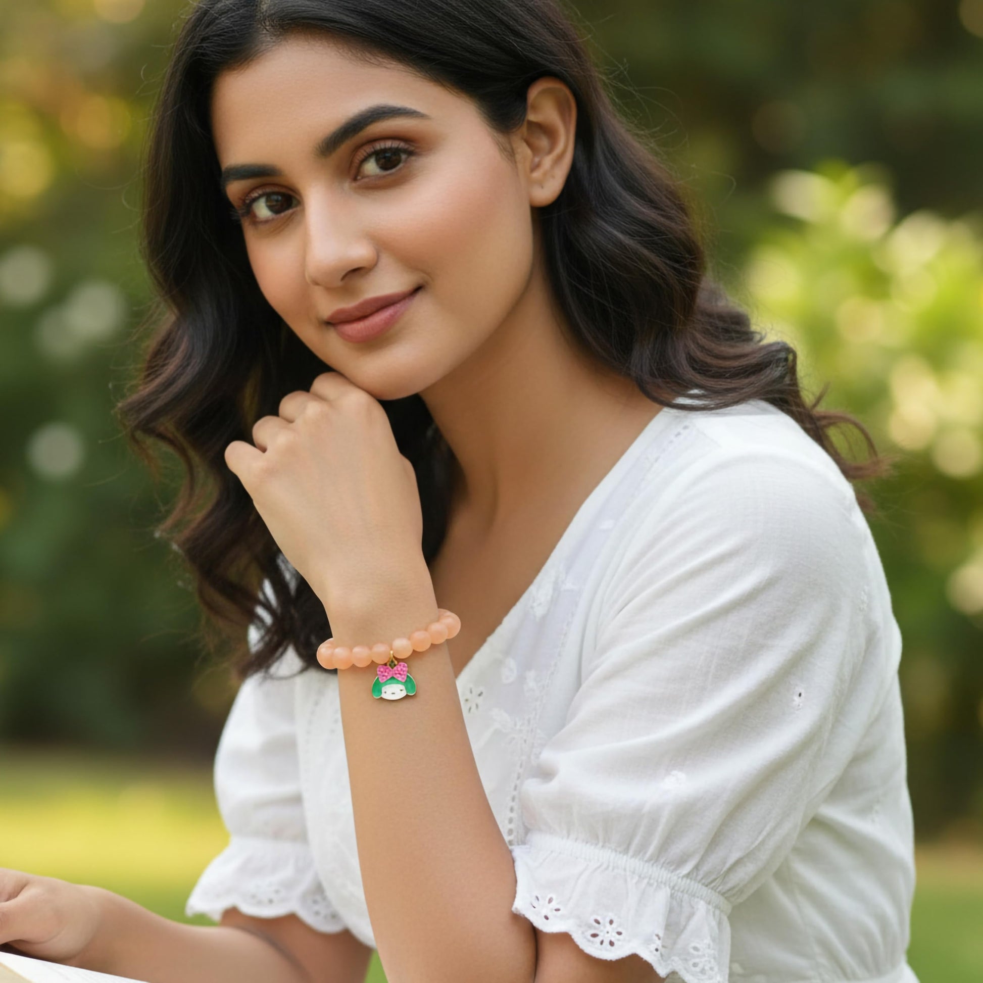 Create easy everyday accessory looks using a peach stretch bracelet with glossy beads.