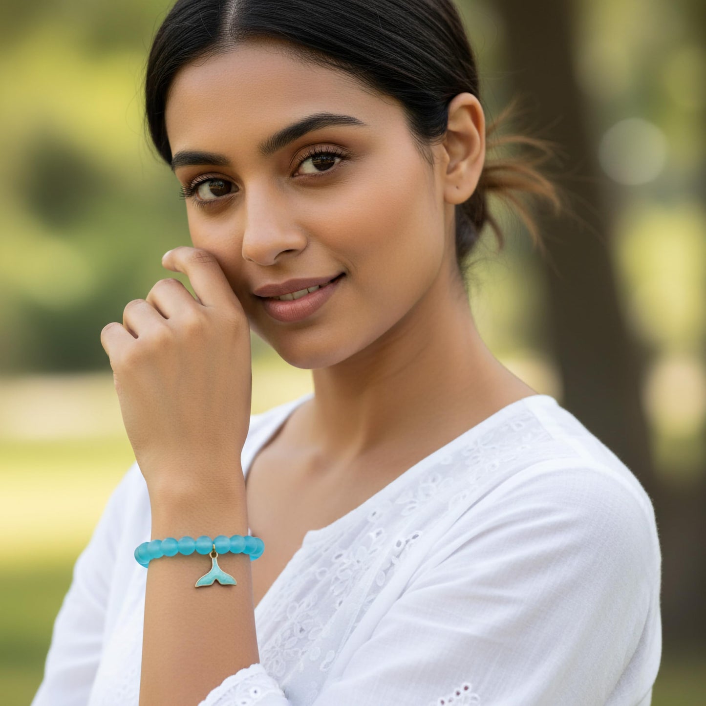 Create easy everyday accessory looks using a blue stretch bracelet with glossy beads.