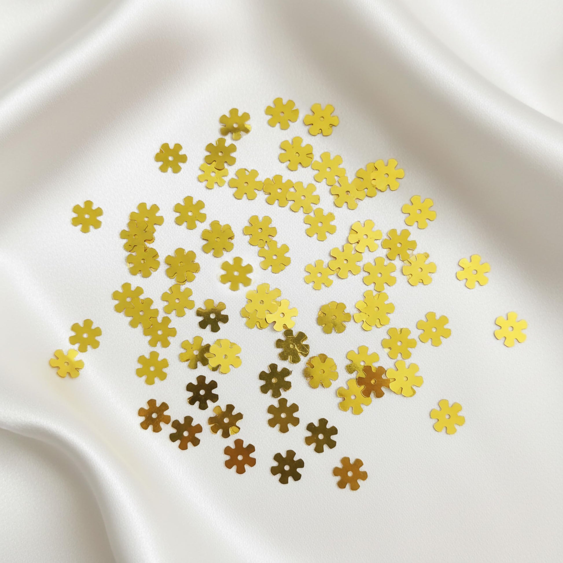 Add metallic texture to dress decoration and boutique craft projects with shiny gold flower embroidery sequins.