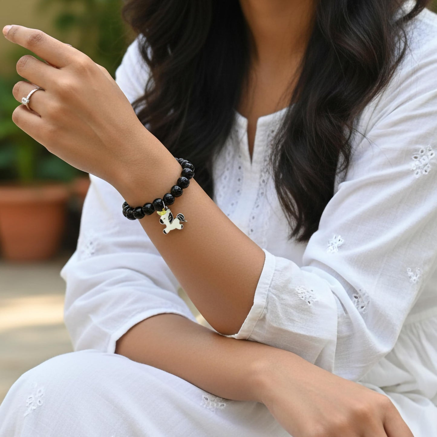 Make daily styling brighter with a black bead bracelet that feels simple and fun.