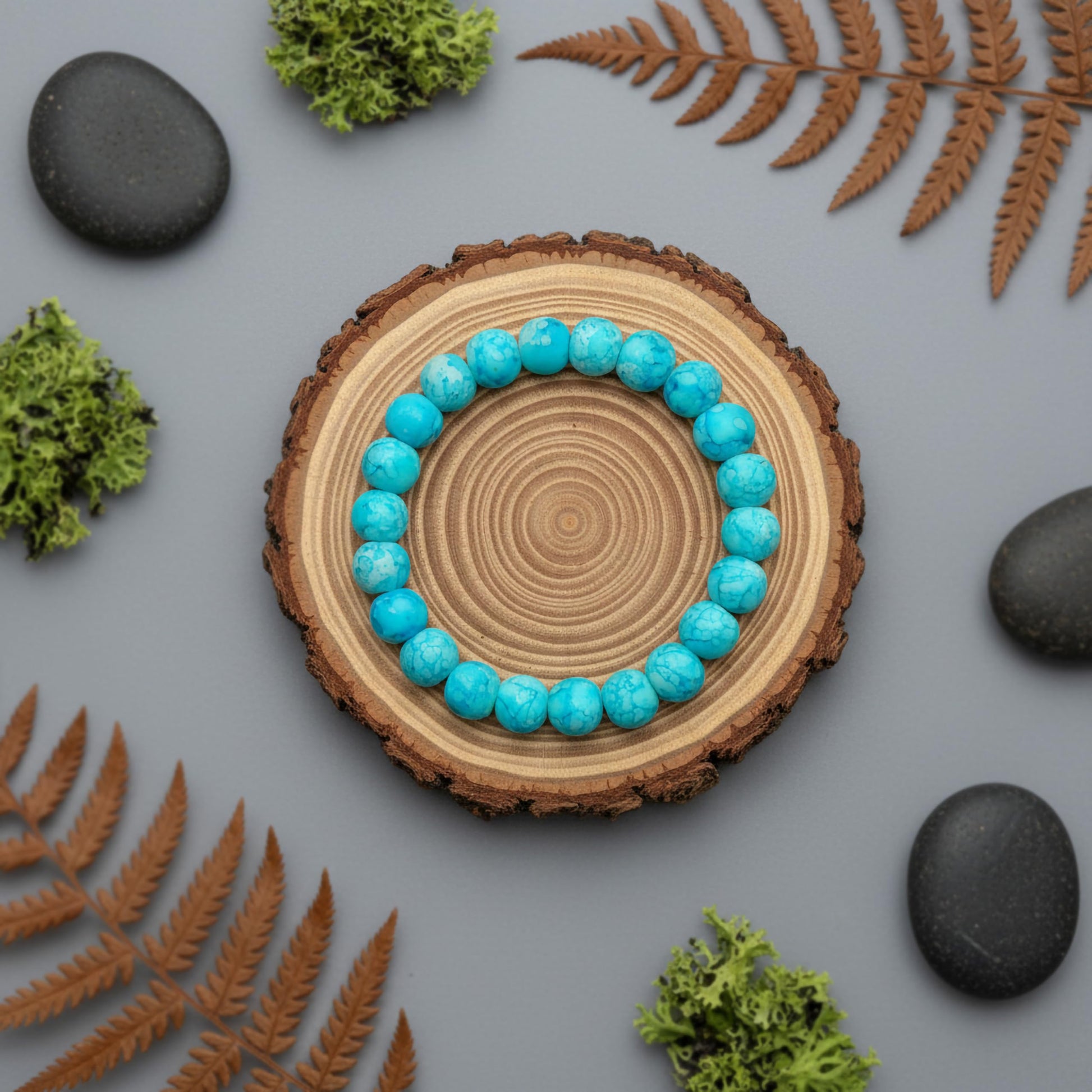 Make matching hand bands feel stylish with sky blue matte marble beads and simple stretch wear.