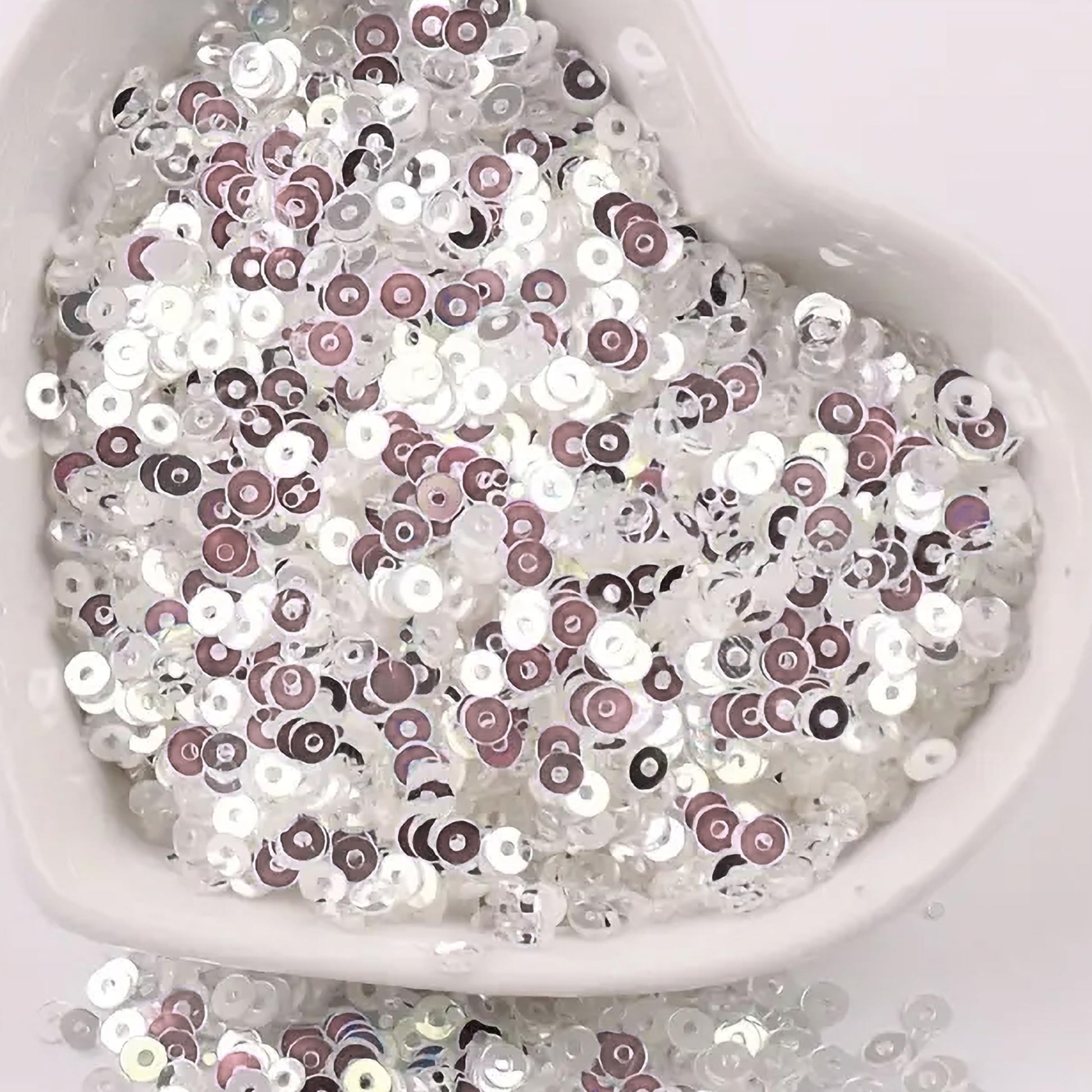 Embroidery for embroidery, craft decoration and fabric embellishment benefits from metallic silver 4mm sequins round shape 4mm sitara sequins with holes and sparkling look.