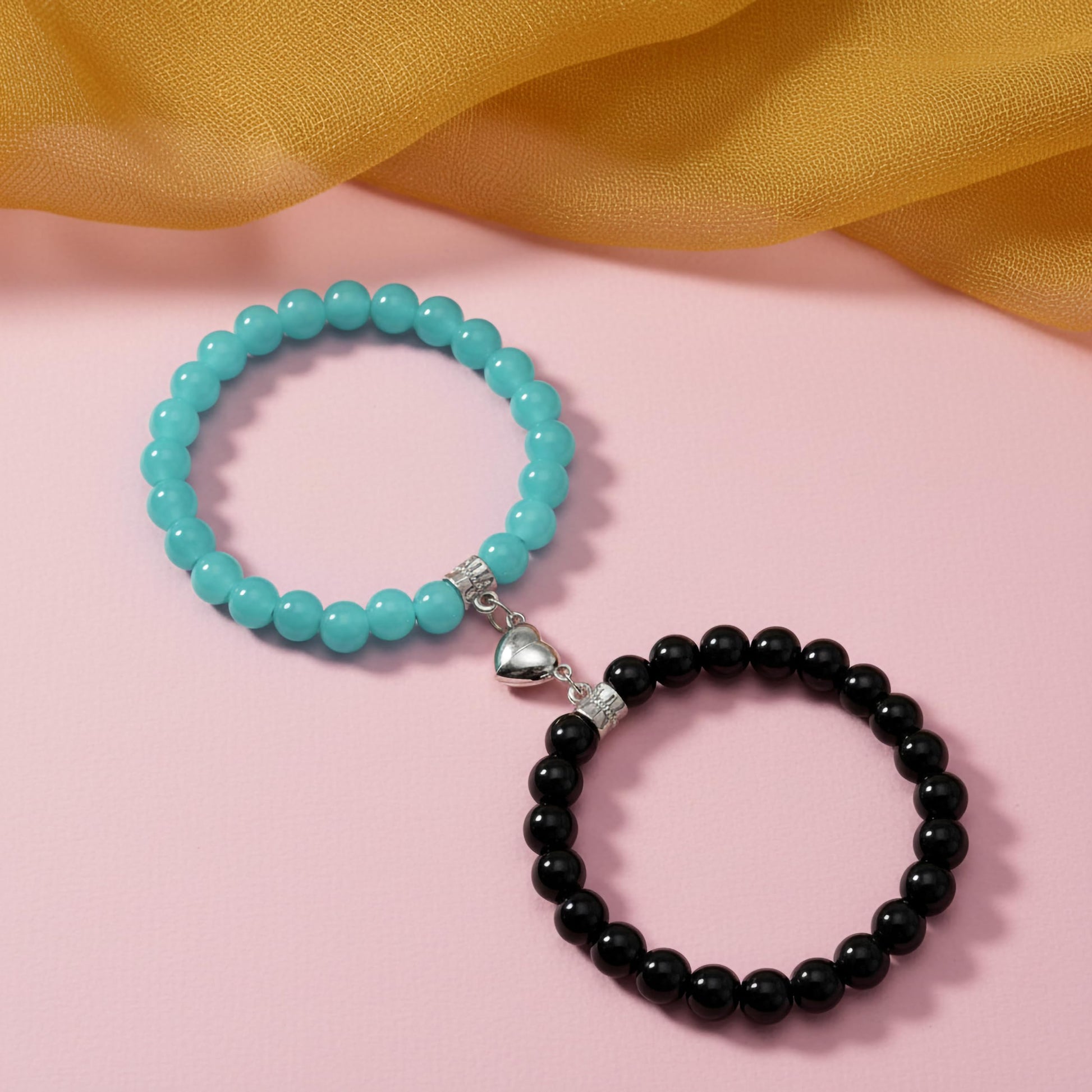 Create a sweet best-friend wrist look using black and blue 1-pair cord bracelets with heart charms.