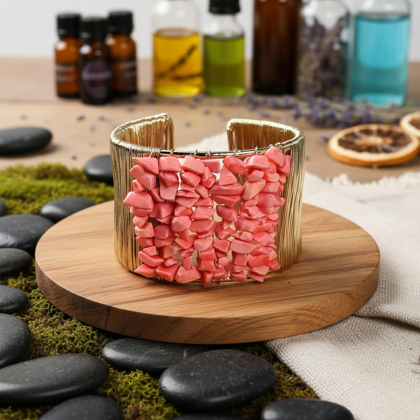 Bring modern jewelry texture to daily looks with pink stone chips wrapped in a cuff design.