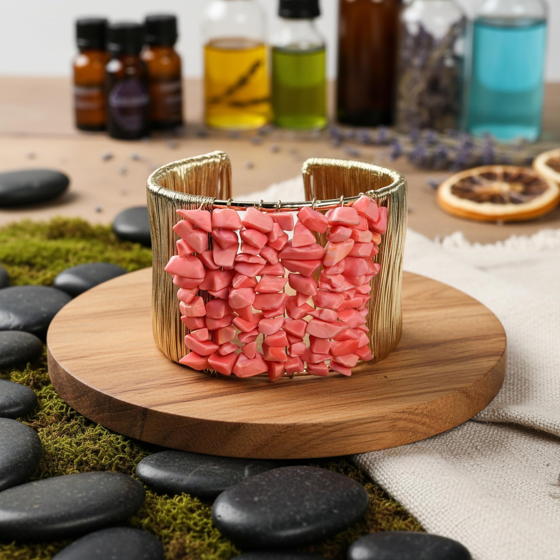 Bring modern jewelry texture to daily looks with pink stone chips wrapped in a cuff design.