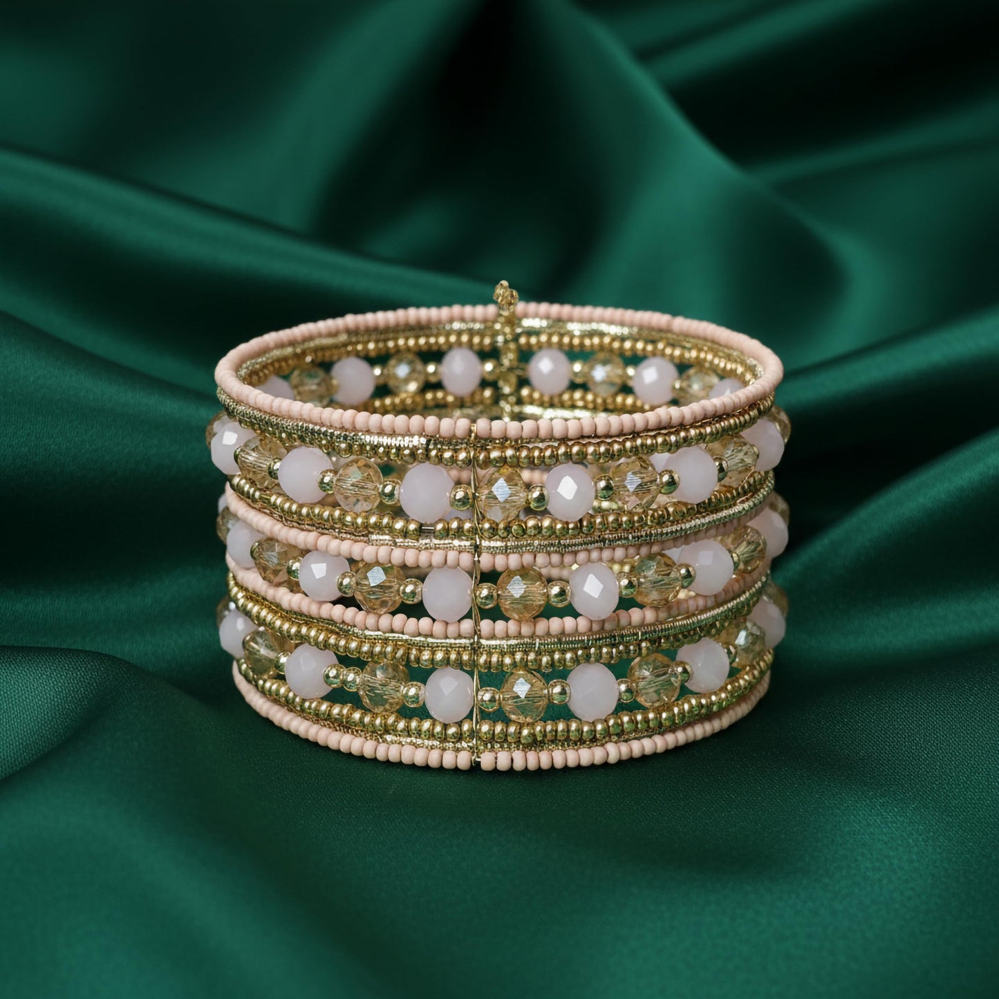 Statement cuff bracelet with stacked pink beads and gold crystals
