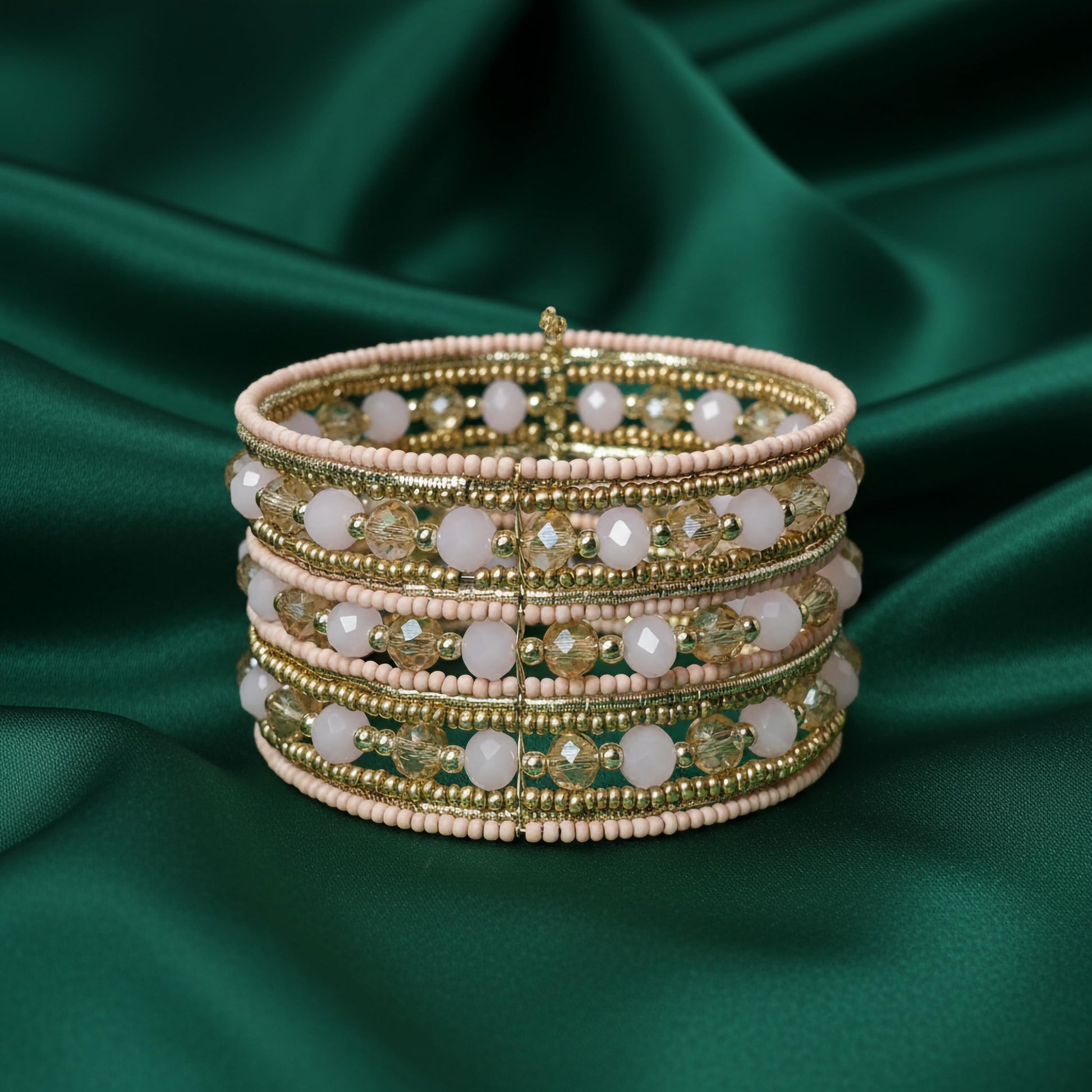 Statement cuff bracelet with stacked pink beads and gold crystals