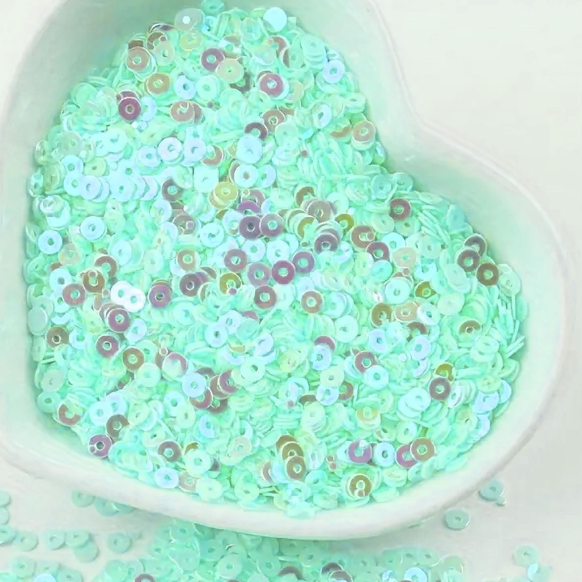 Sparkling look comes through clearly in aqua 4mm sequins round shape 4mm sitara sequins with holes for Embroidery for embroidery, craft decoration and fabric embellishment.