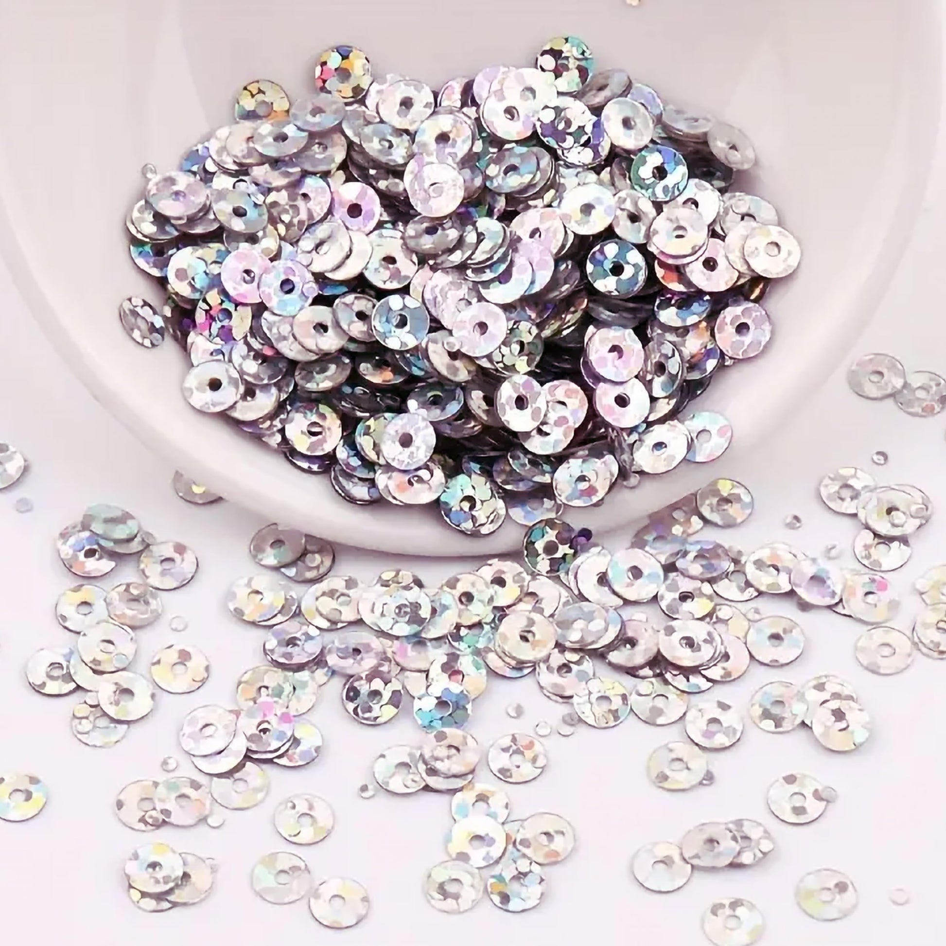 The sparkling look of silver pink 4mm sequins round shape 4mm sitara sequins with holes supports Embroidery for embroidery, craft decoration and fabric embellishment.