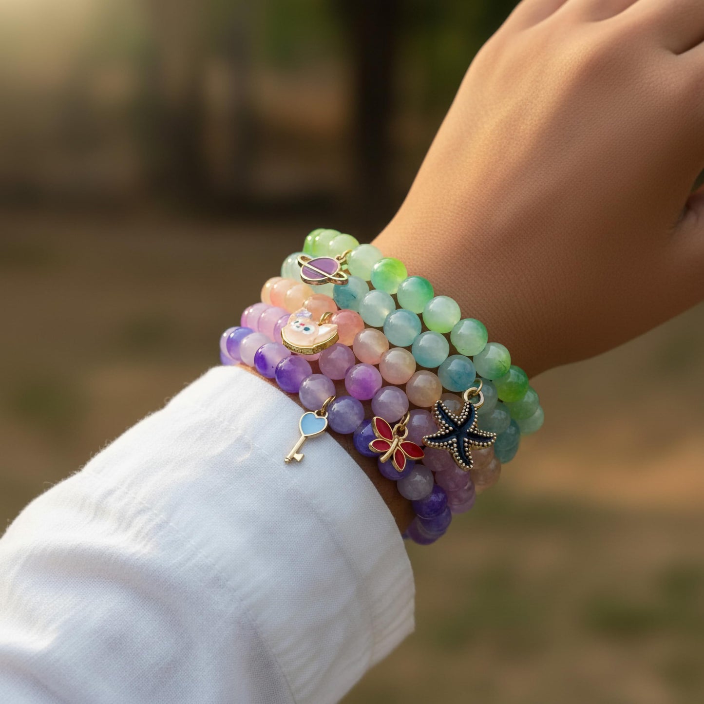 Create a playful accessory look using multicolor dualtone beads and cute bracelet charms.