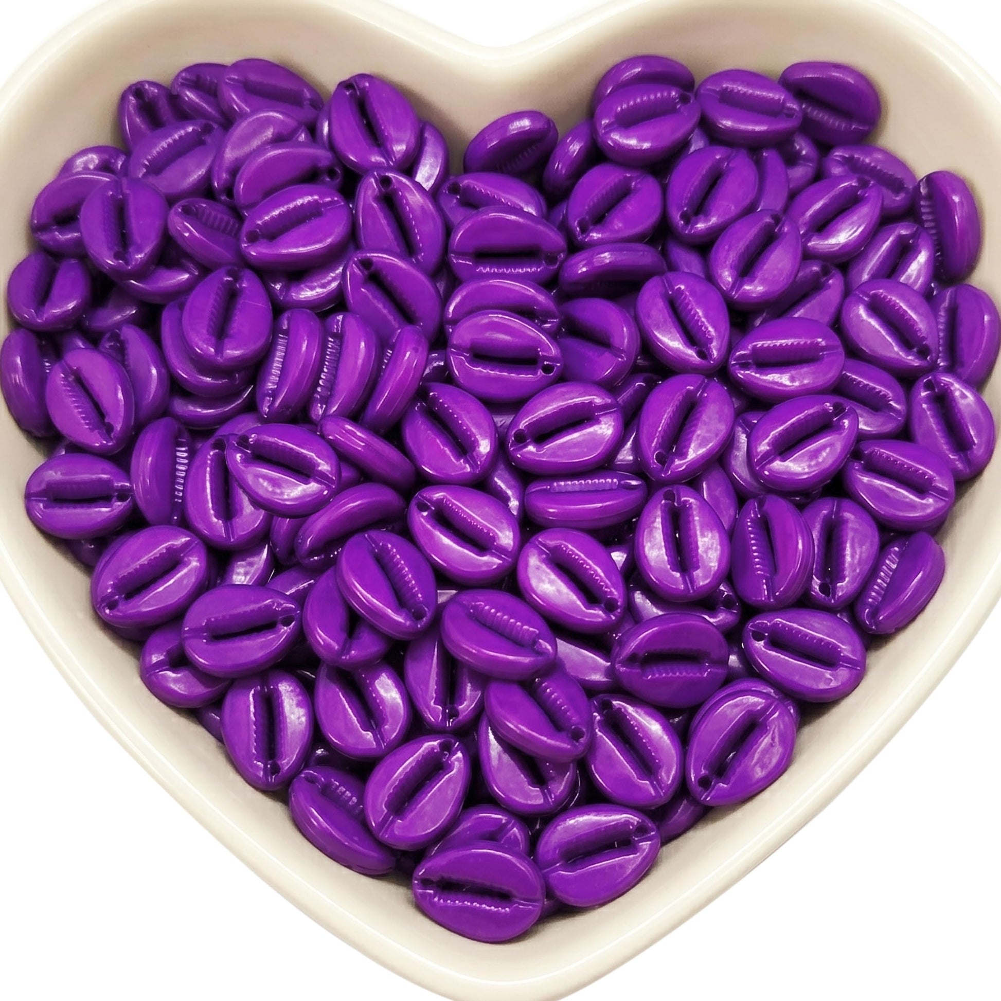 Bring coastal boho texture to bracelets and anklets with purple faux cowrie shell beads.