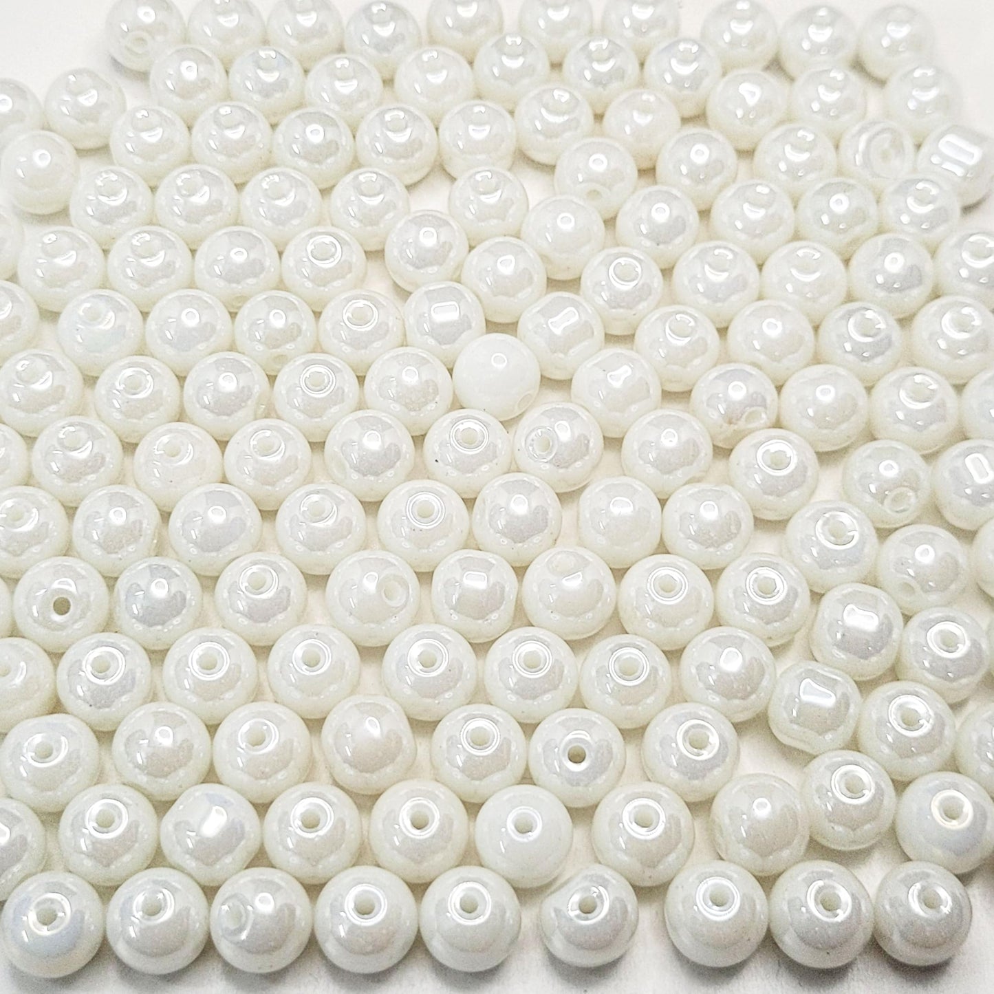 Use white and multicolour 8mm beads to give bracelet making, necklace making and DIY jewellery projects a clean decorative look with white detail.