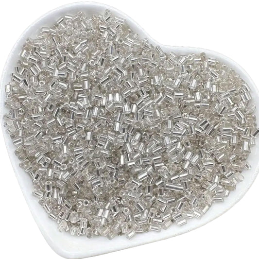 In DIY craft projects, creative hobby work and decorative handmade designs, white and silver 2.5mm small cut cylinder silverline tubes 2.5mm shiny adds depth and neat finishing.