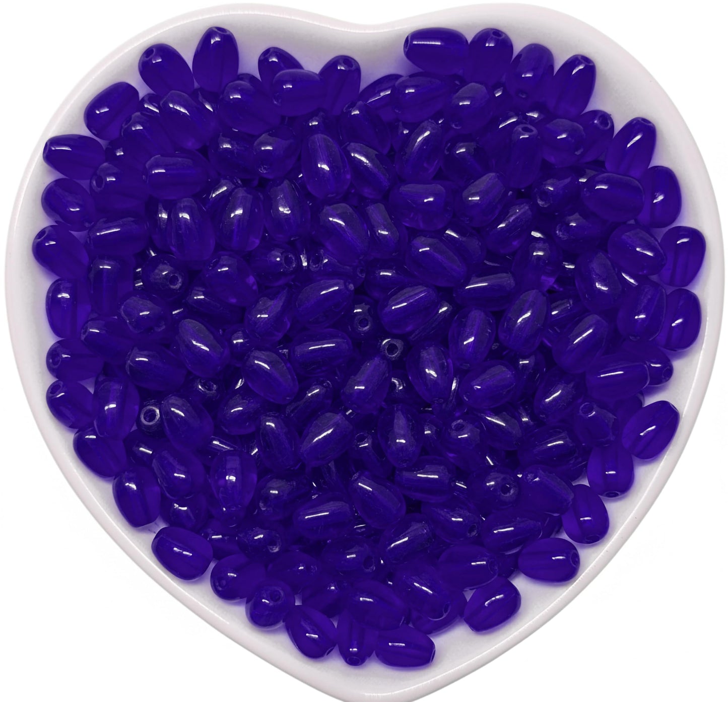 Show a clean craft look in bracelet making with 8x5mm blue transparent smooth glass beads for saree kuchu work.