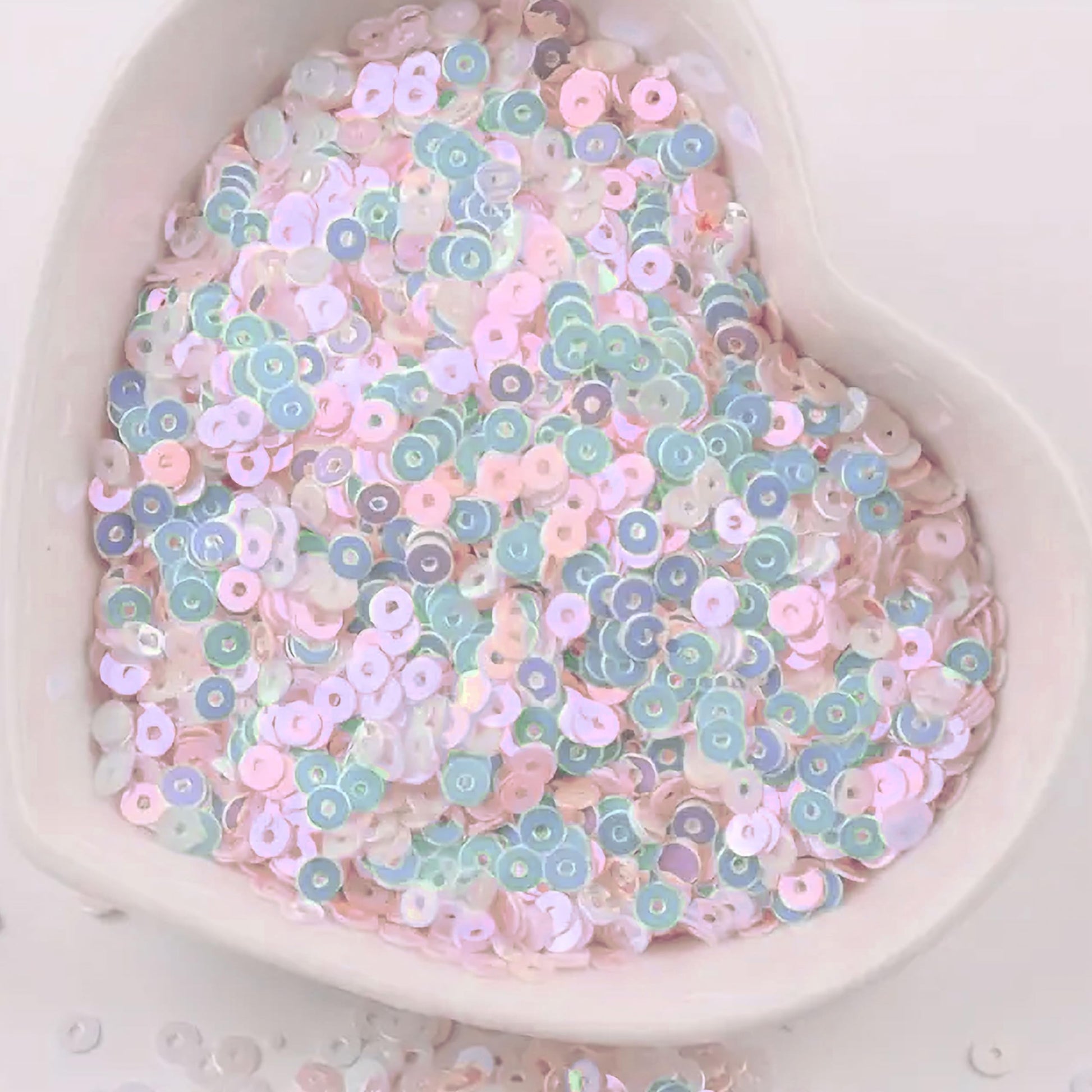 Embroidery for embroidery, craft decoration and fabric embellishment can be finished with pale pink 4mm sequins round shape 4mm sitara sequins with holes for sparkling look.