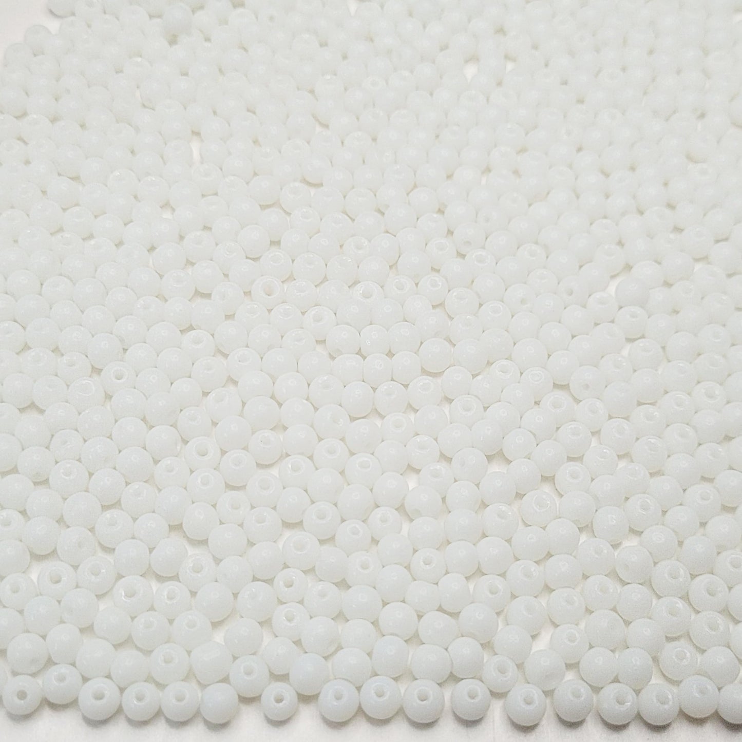 Clean decorative look comes through clearly in white and multicolour 4mm beads for bracelet making, necklace making and DIY jewellery projects.