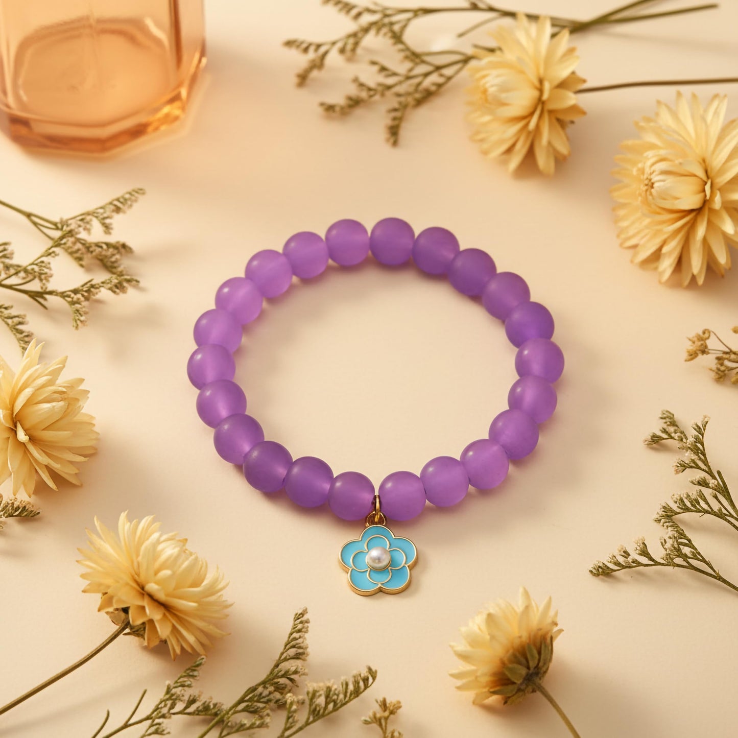 Bring cute charm detail to casual outfits with a purple beaded bracelet for girls and women.