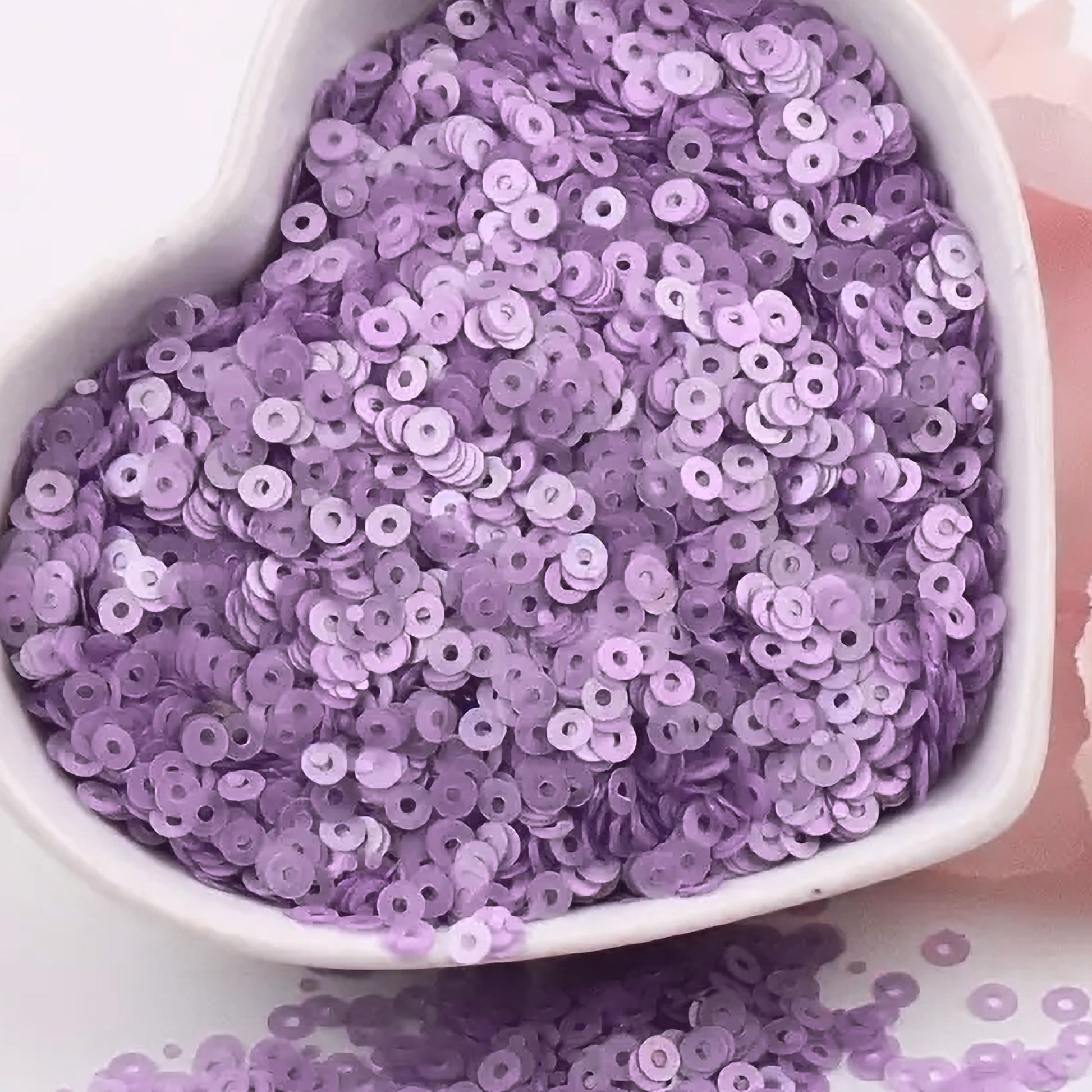 Light purple 4mm sequins round shape 4mm sitara sequins with holes for embroidery offer a neat decorative finish for fabric embellishment, card making and decorative craft.