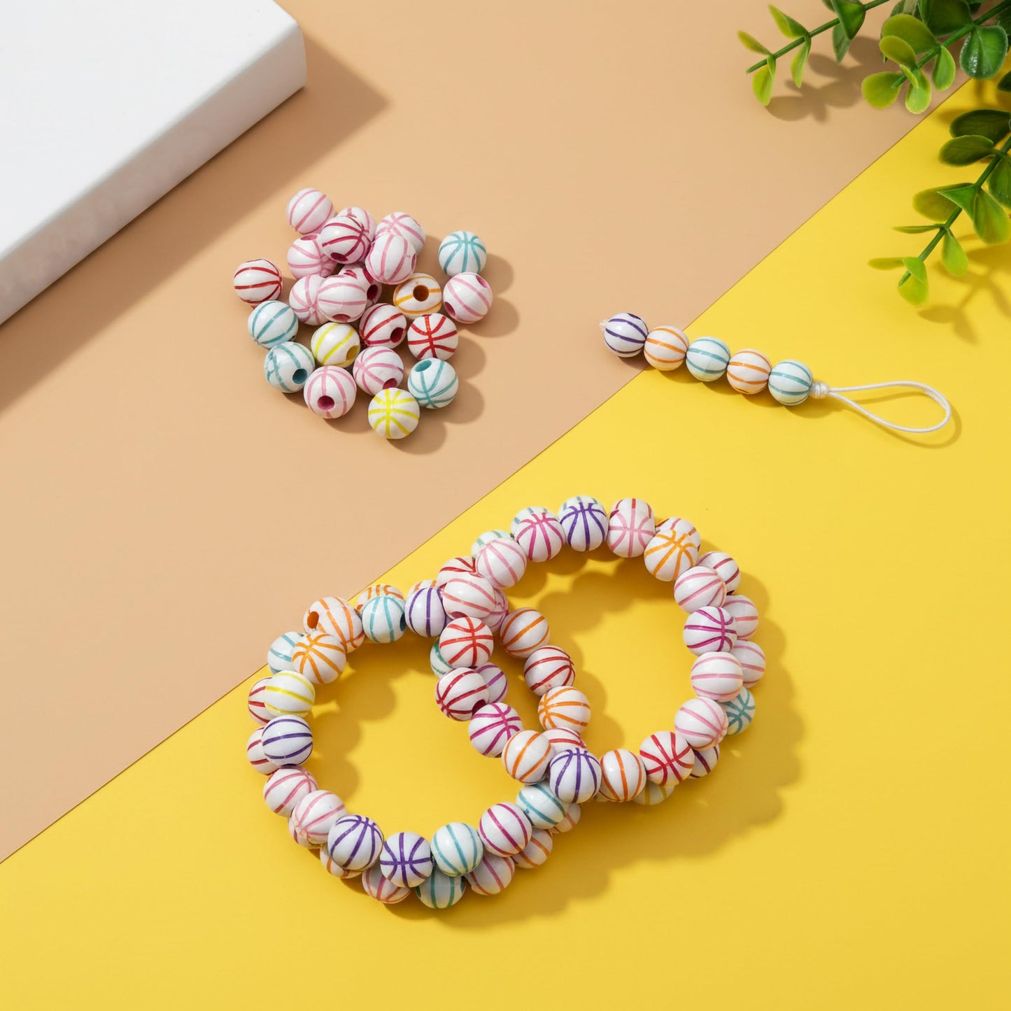 Decorative white beads with multicolor stripe detailing