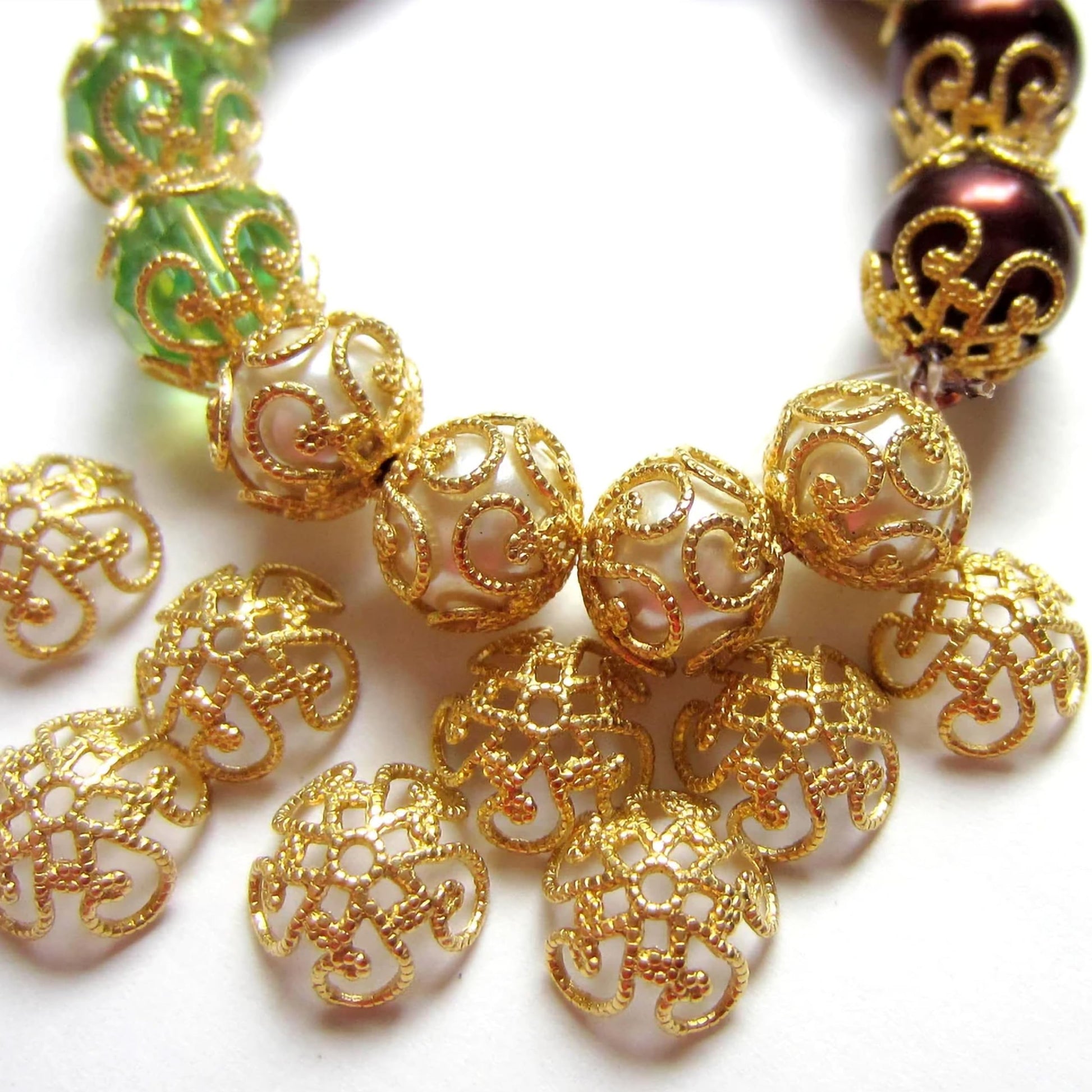 Add eye-catching detail to jhumka making and latkan work using jewelry-ready jhumka cap findings.