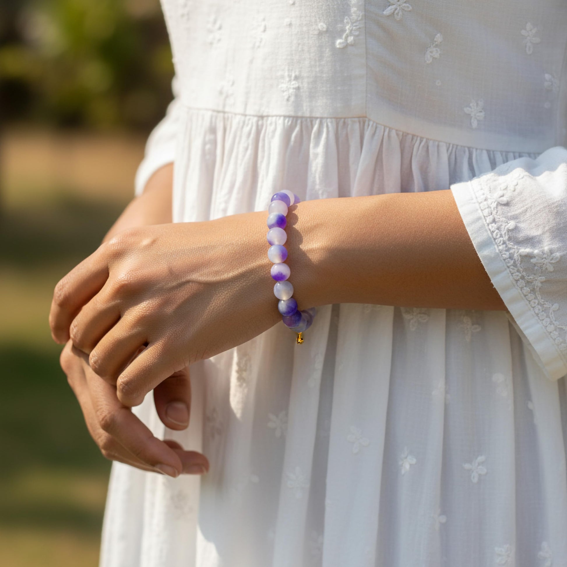 Create a playful accessory look using purple dualtone beads and cute bracelet charms.
