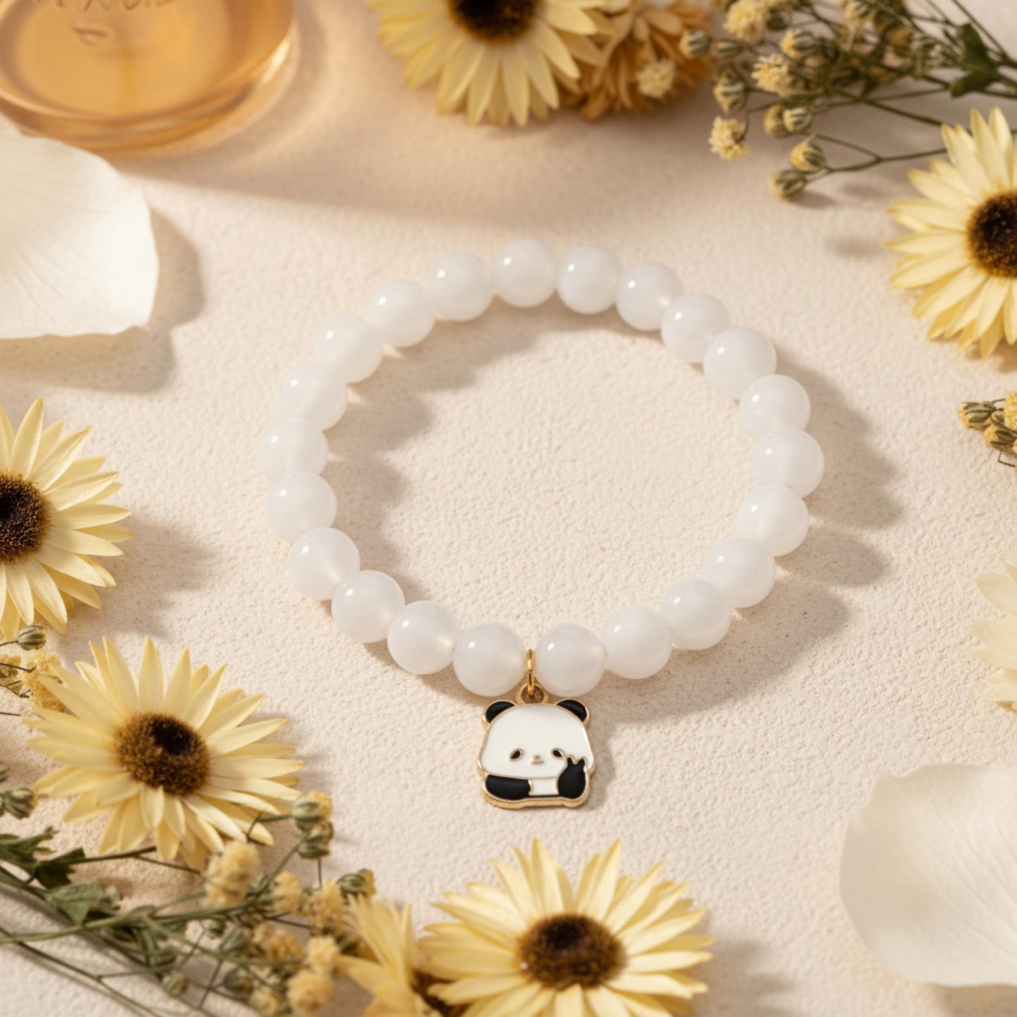 Bring cute charm detail to casual outfits with a white beaded bracelet for girls and women.