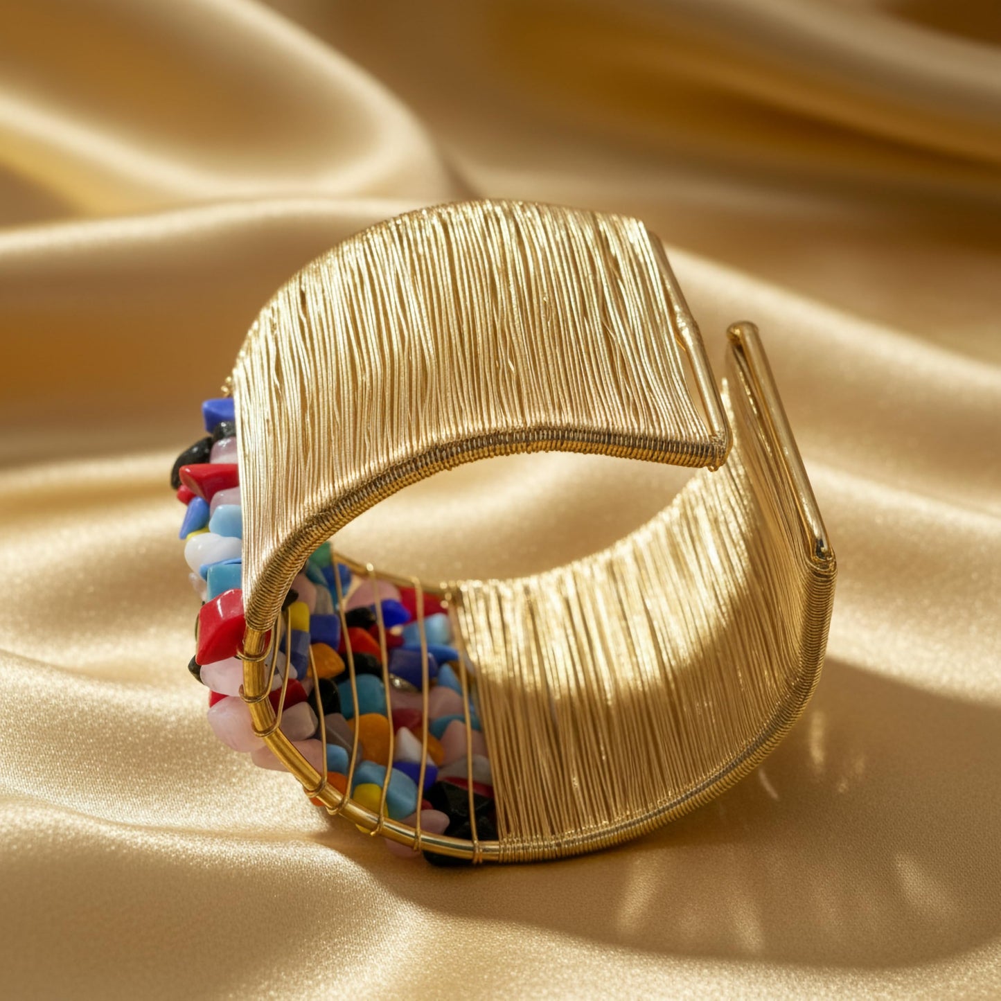 Give casual accessories a polished edge with a multicolor open cuff bracelet and stone detail.