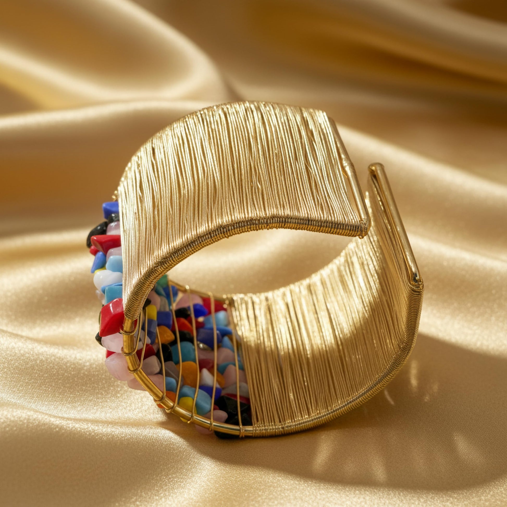 Give casual accessories a polished edge with a multicolor open cuff bracelet and stone detail.