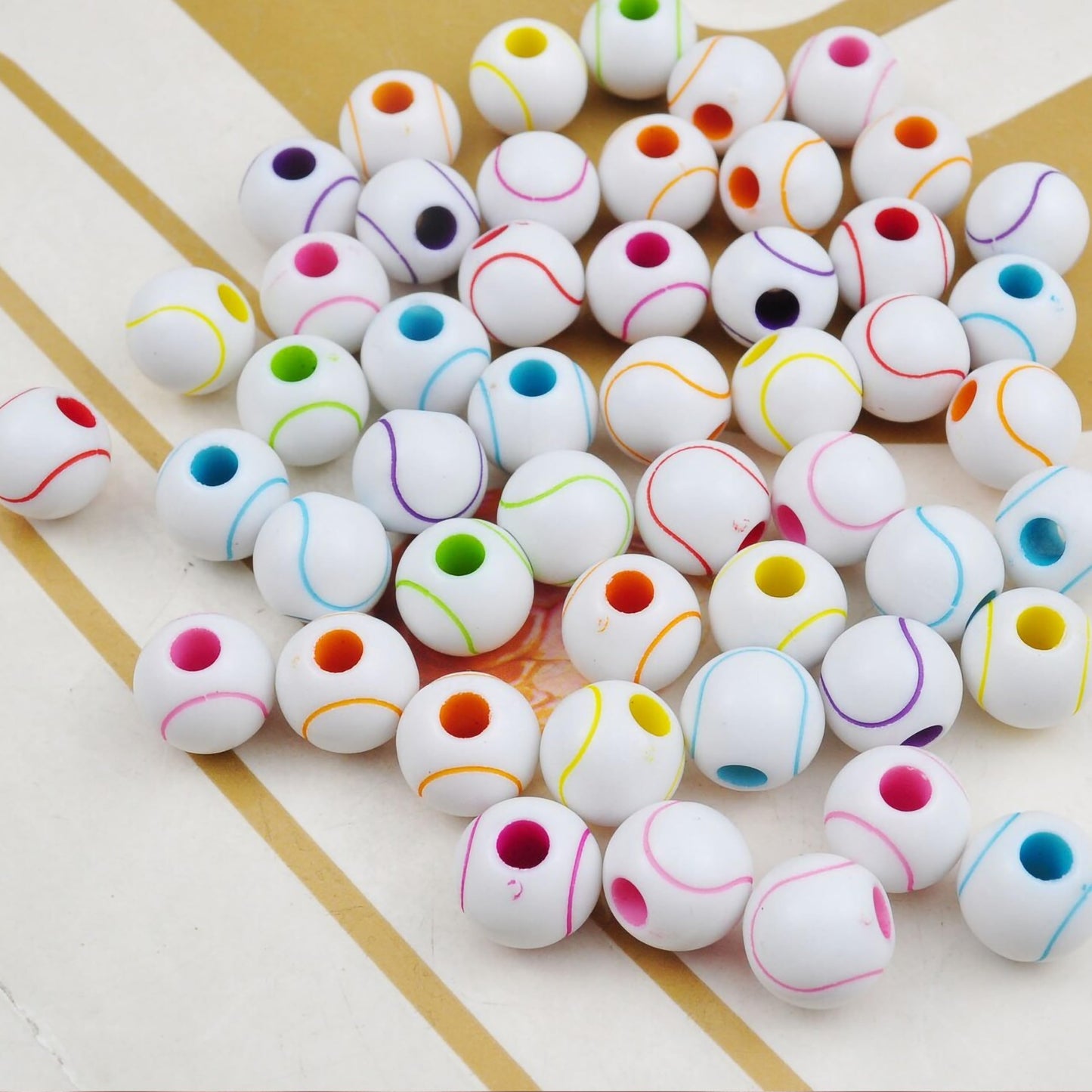 Round beads with soft wave stripe design