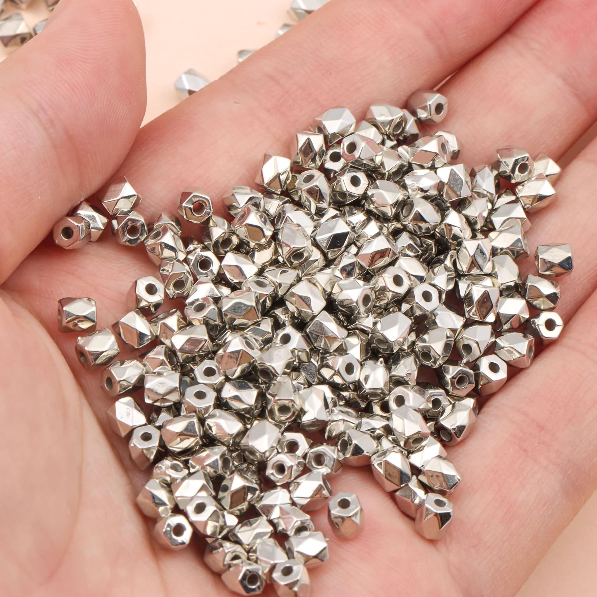 For a cleaner finish in necklace making and DIY jewellery projects, drum silver and gold plastic and acrylic beads are a useful choice.