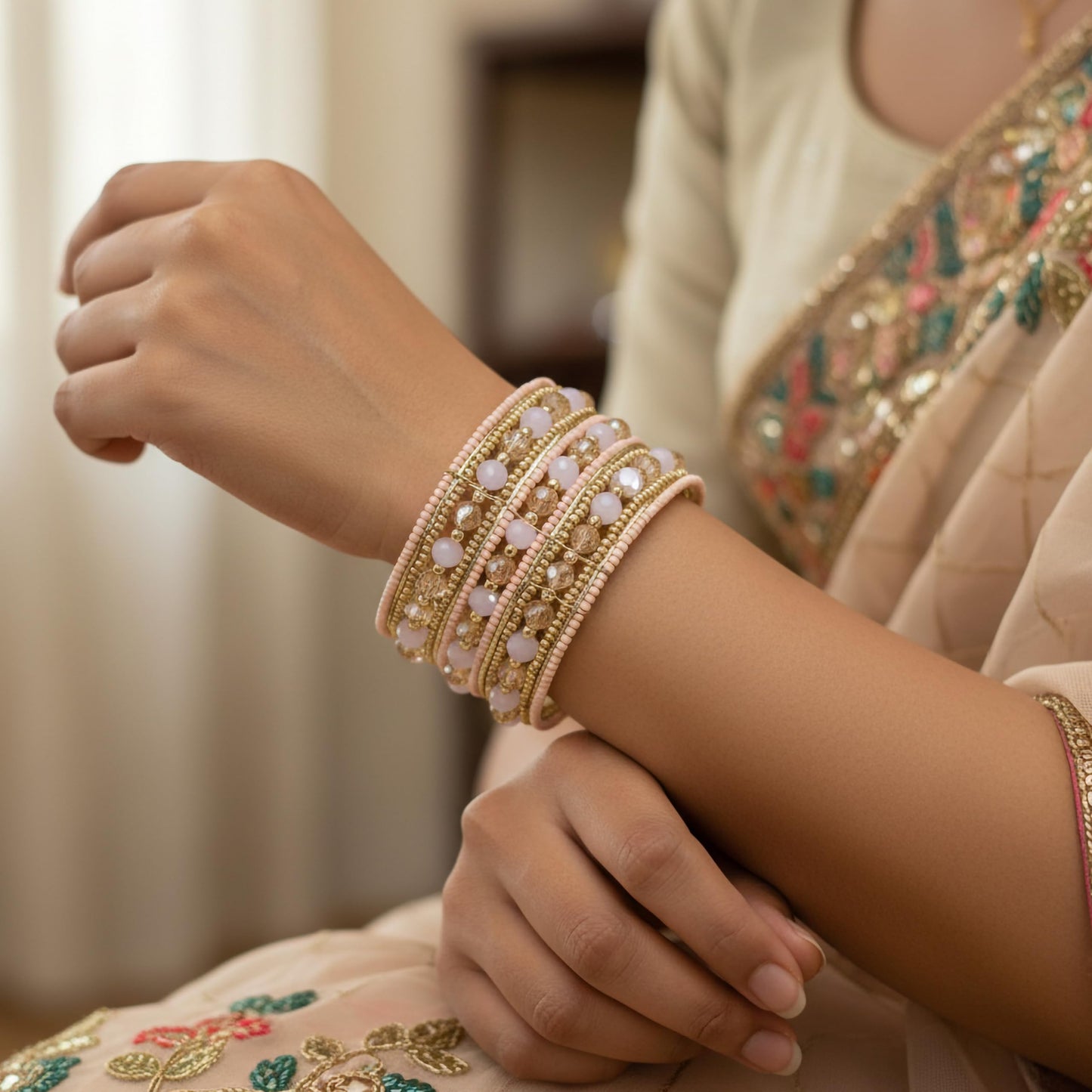 Ethnic style pink and gold bead bracelet with layered pattern