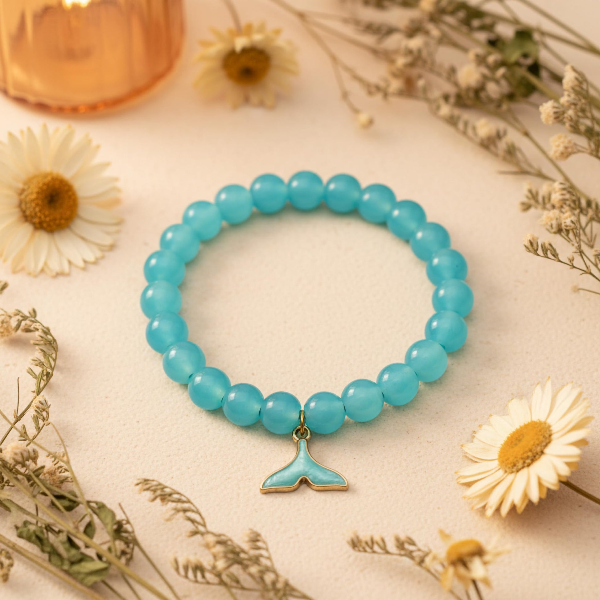 Bring cute charm detail to casual outfits with a blue beaded bracelet for girls and women.