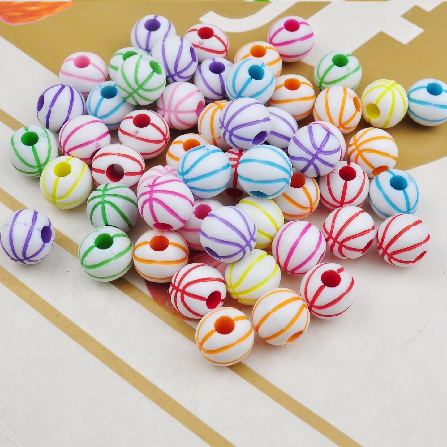 Decorative white beads with multicolor stripe detailing