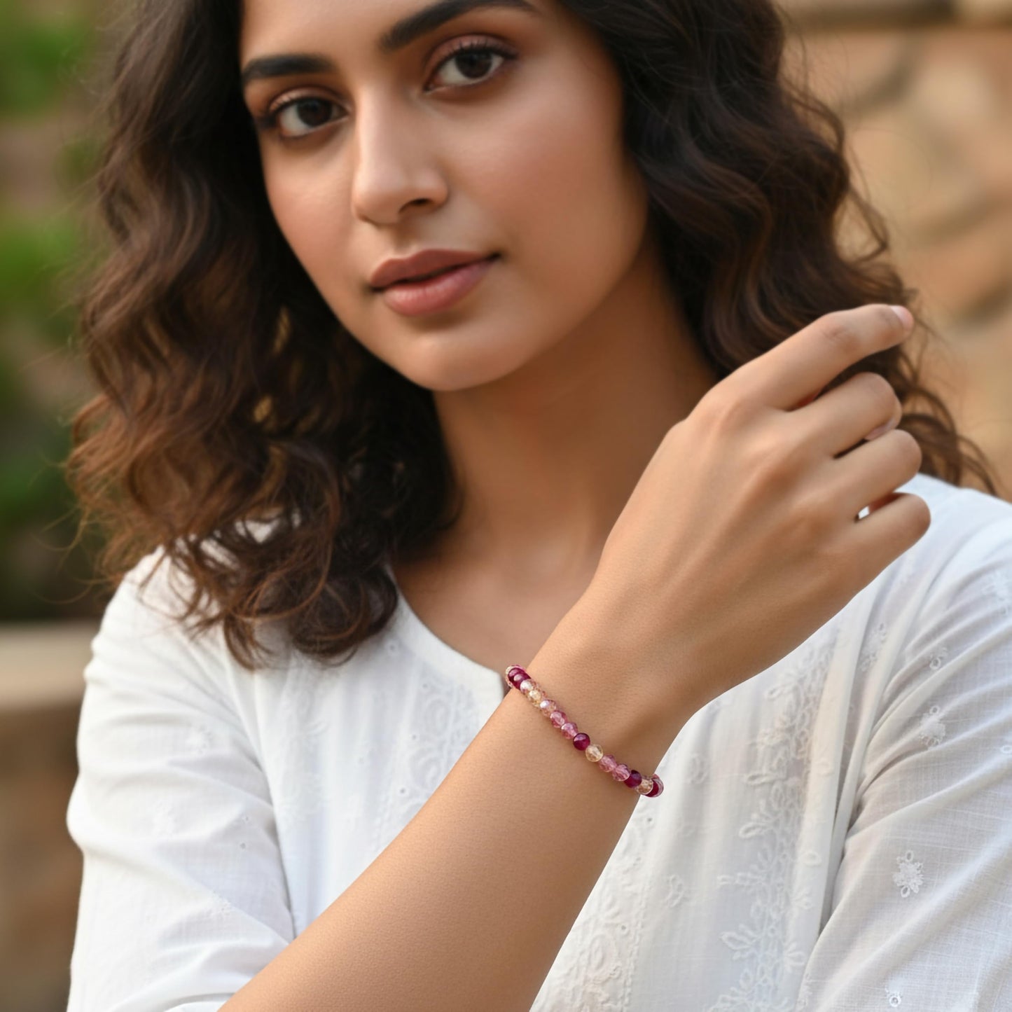 Create a bright friendship accessory look using pink bicone beads and stretch bracelet styling.