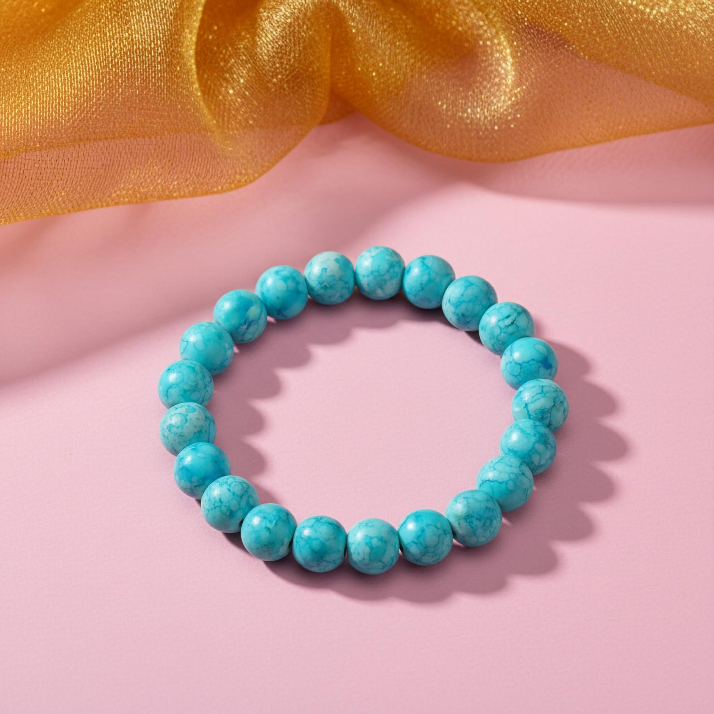 Bring playful color texture to stacked bracelets with sky blue rounded marble-style beads.